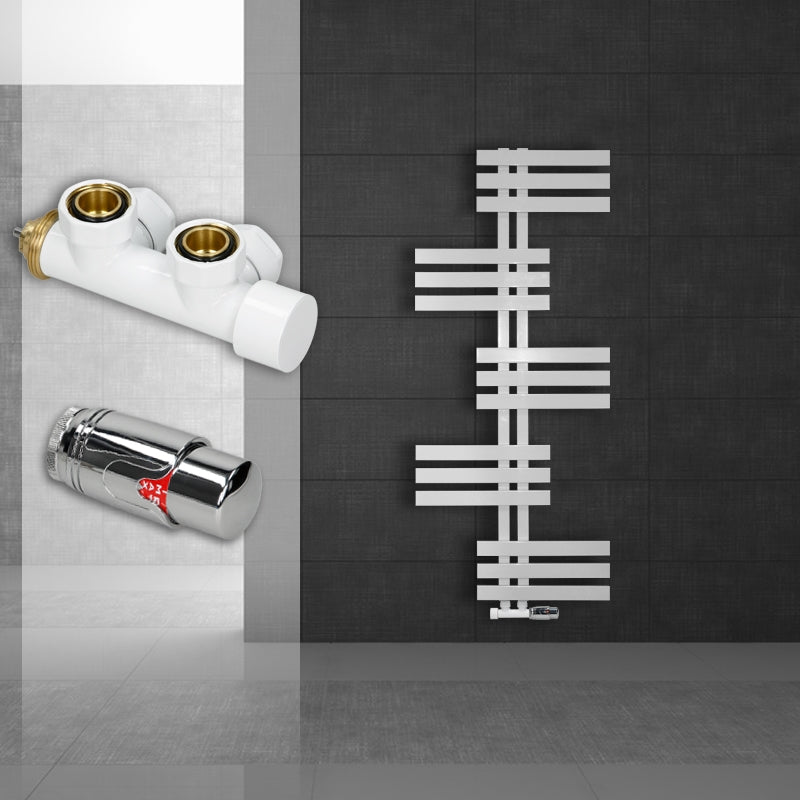 White radiator on a dark wall with two fittings.