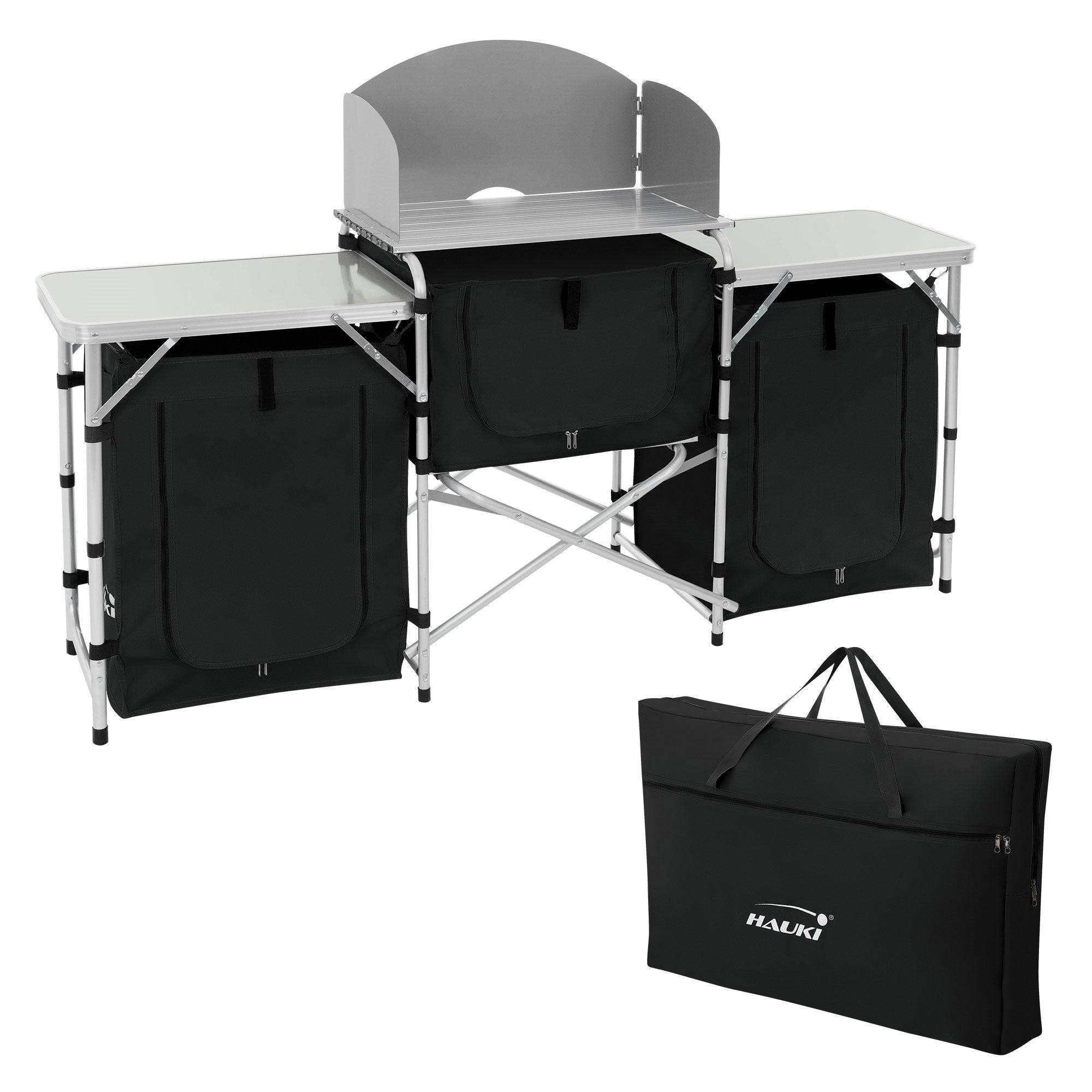 Une table pliante avec deux sacs noirs et une étagère supérieure.