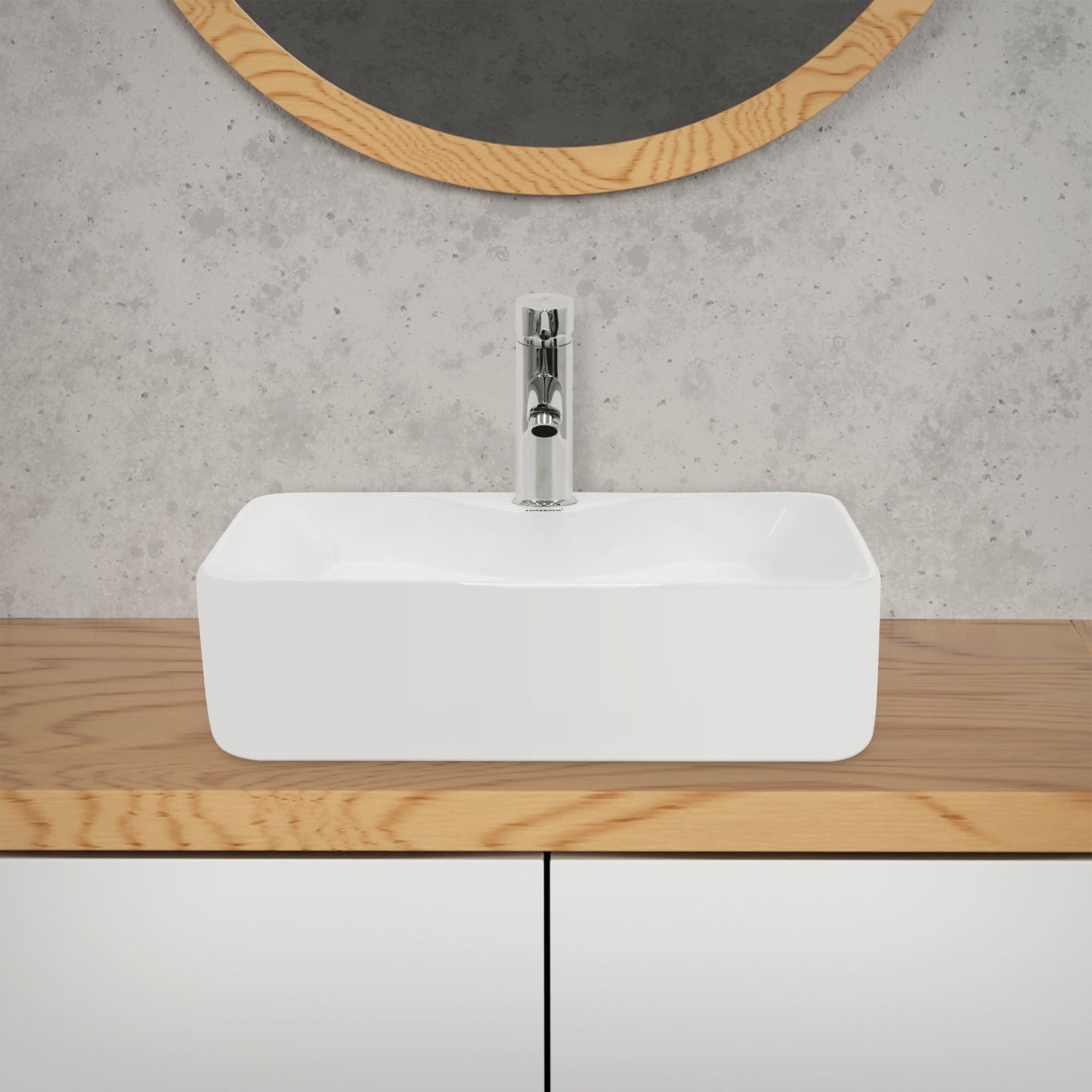 Rectangular sink on a wooden dresser in front of a mirror.