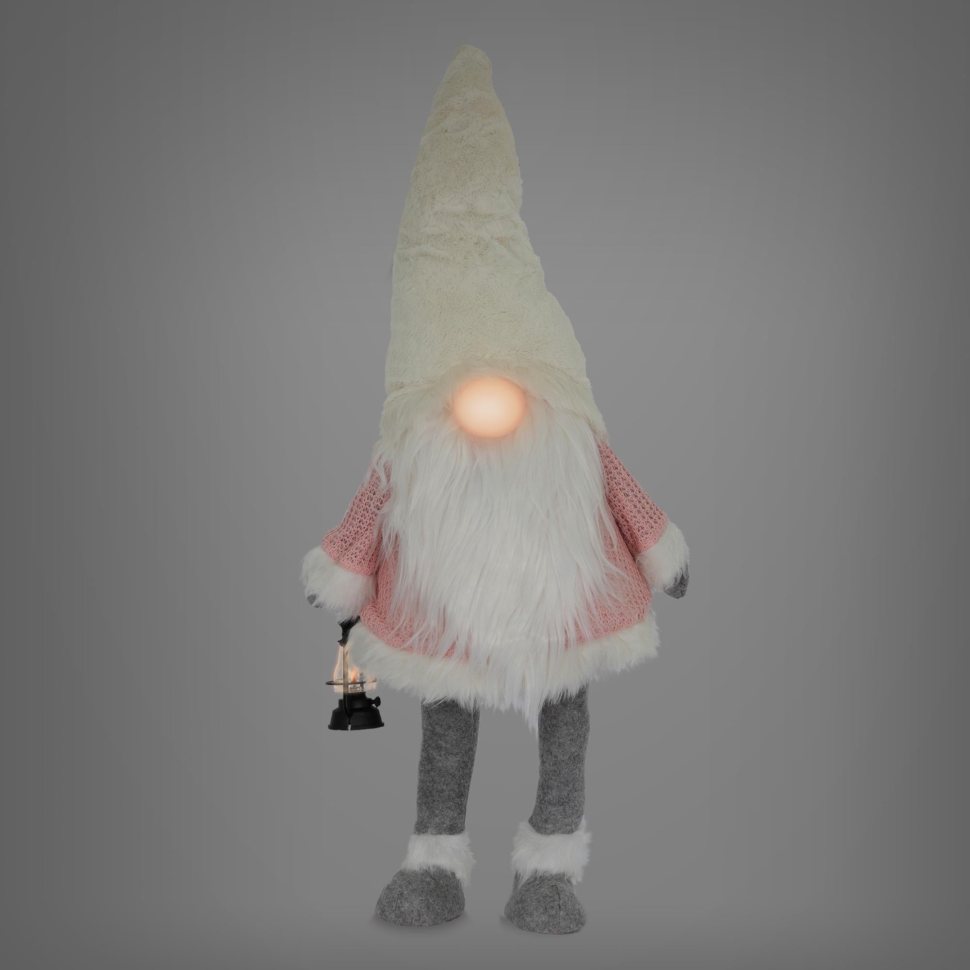 Plüschfigur eines Gnomes mit weißem Bart und Laterne.