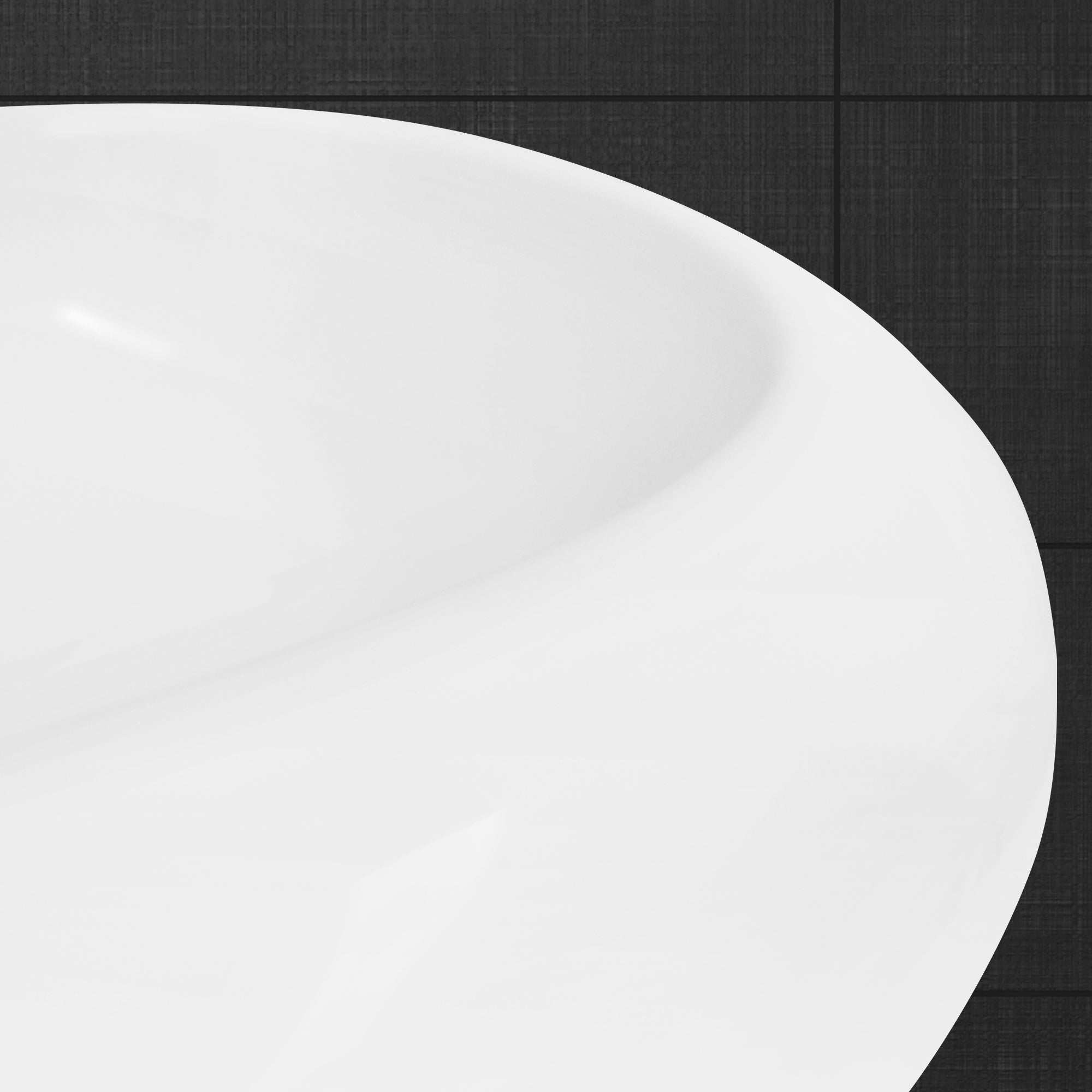 Close-up of the edge of a round, white sink.
