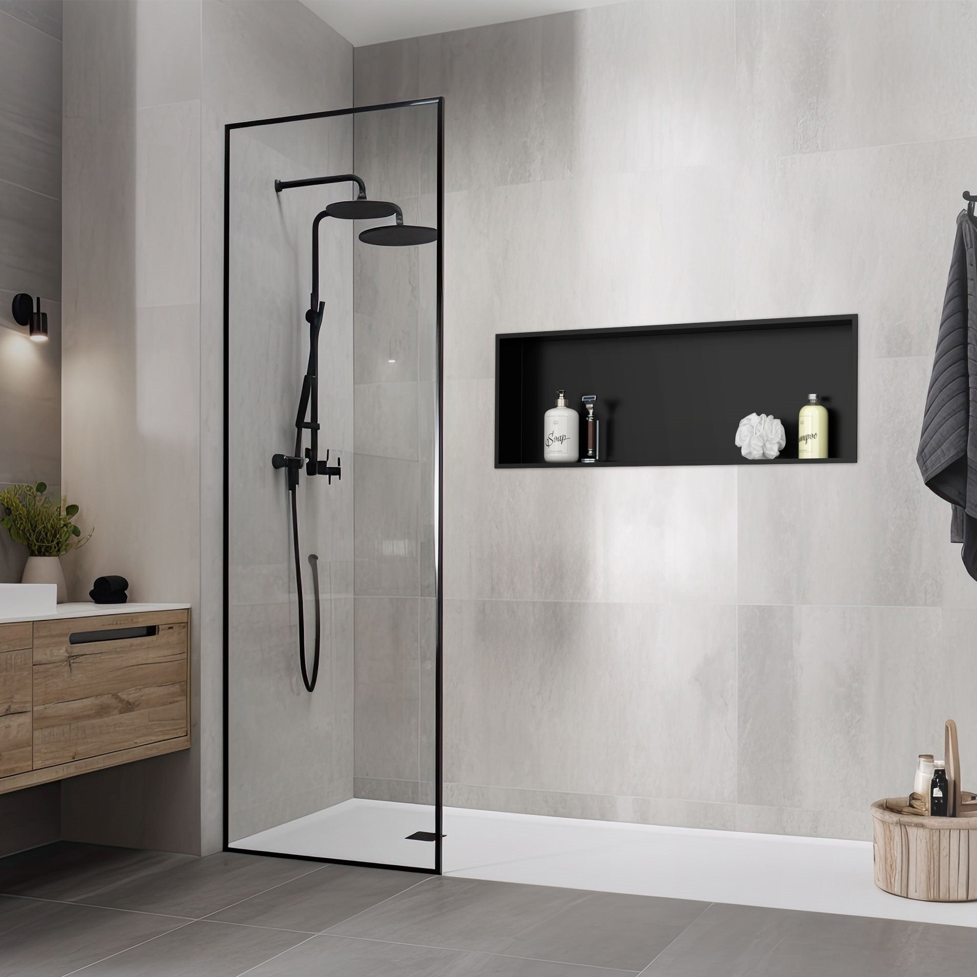 Shower area with black shower head and niche in gray wall.