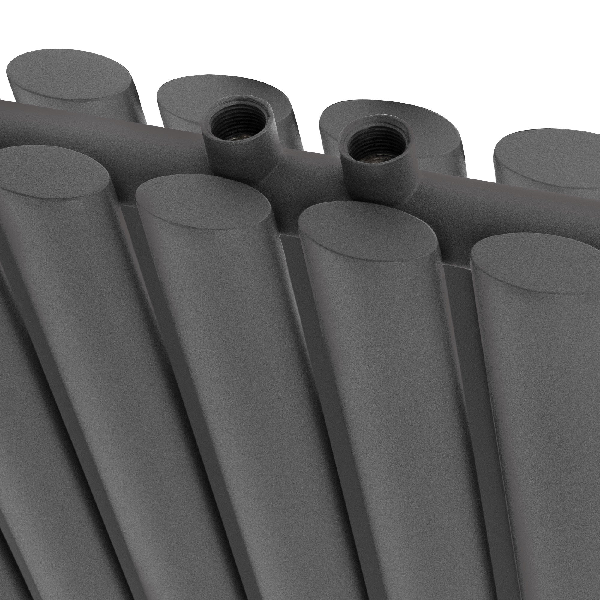 Close-up of a dark gray radiator with two connections.