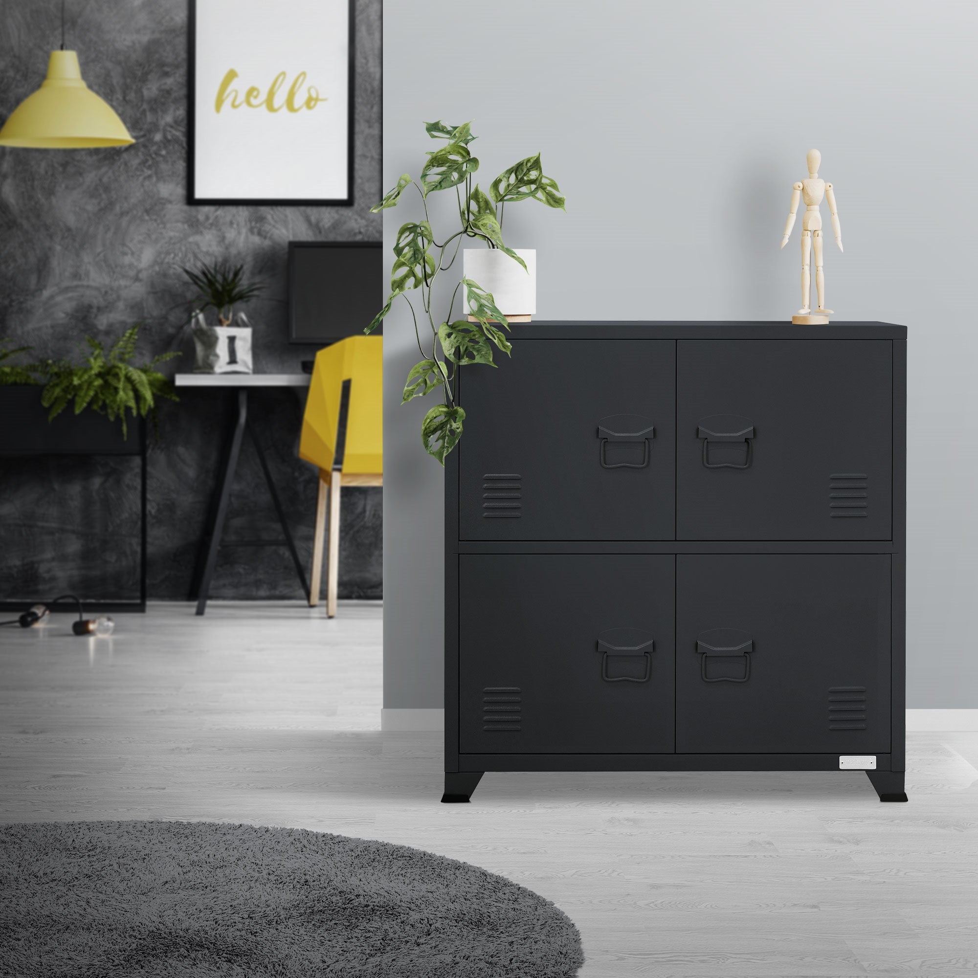 Schwarzer Schrank in einem modernen Raum mit Pflanze und Dekoration.