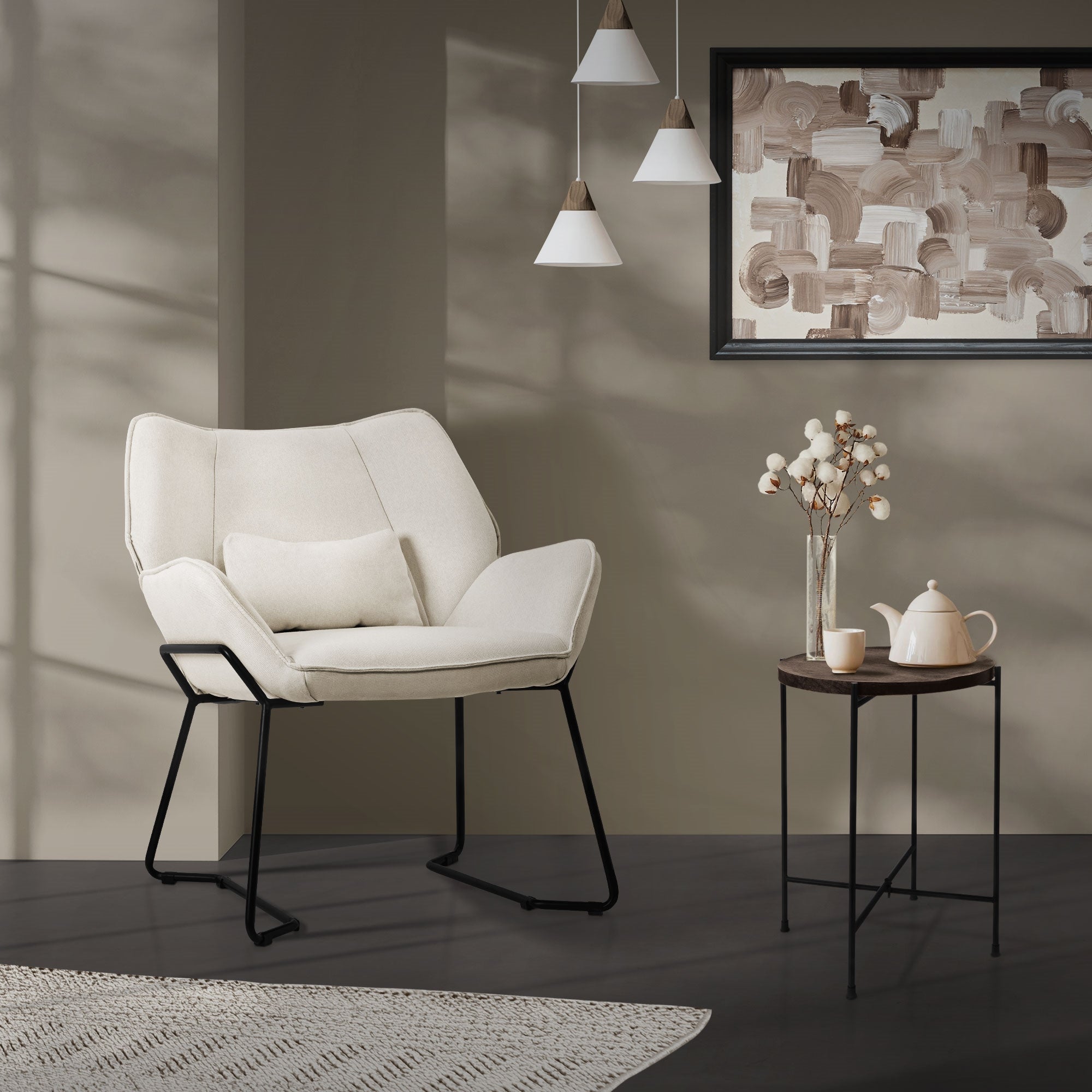 Beige armchair in a room with decoration and table.