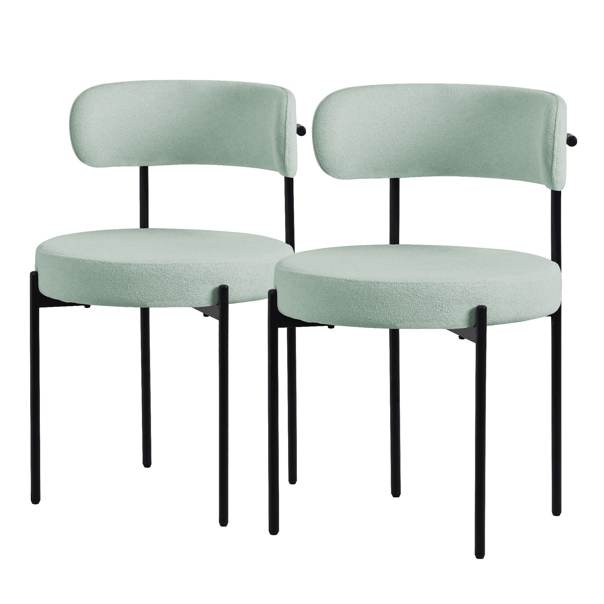 Two green chairs with round seats and backrests on black legs.