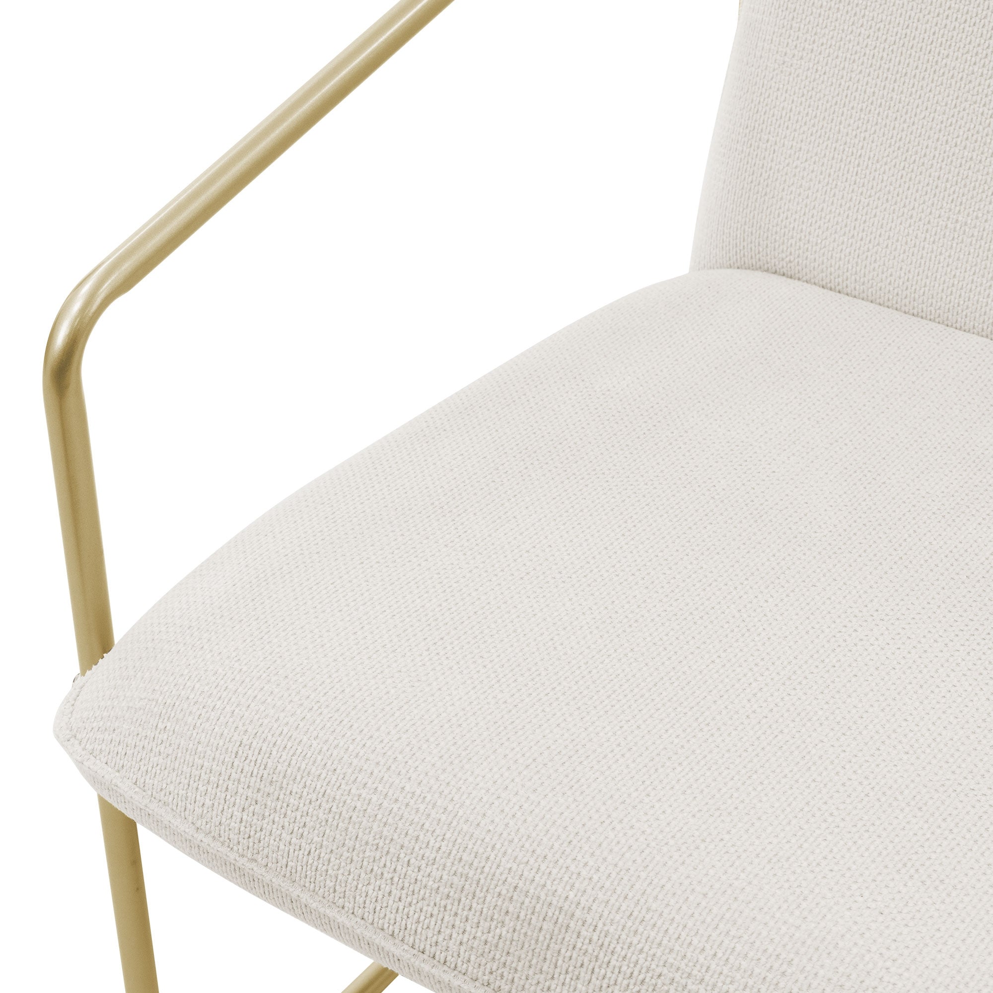 Close-up of a white chair with a gold-colored frame.
