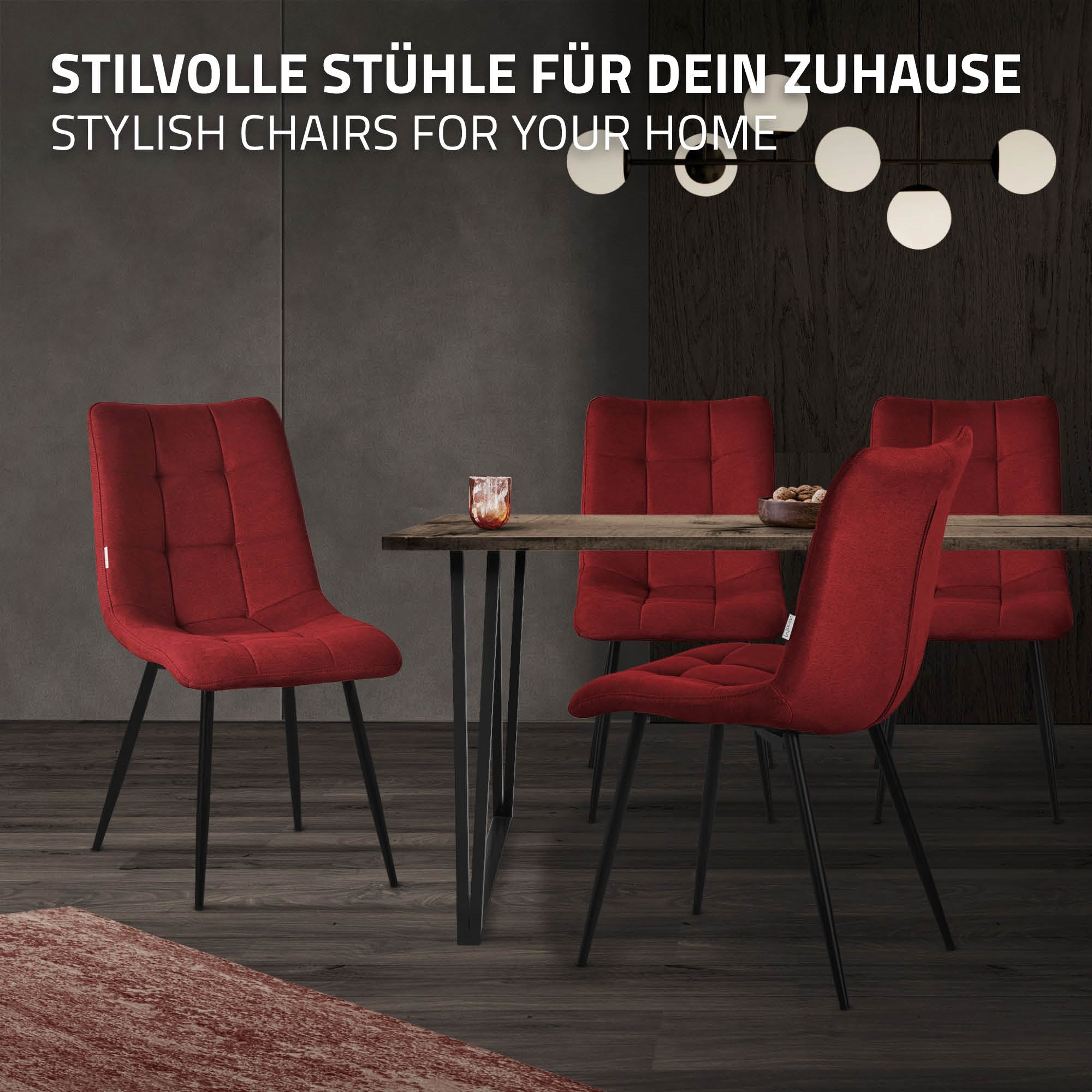 Sedie rosse attorno a un tavolo in una stanza moderna con lampade decorative.