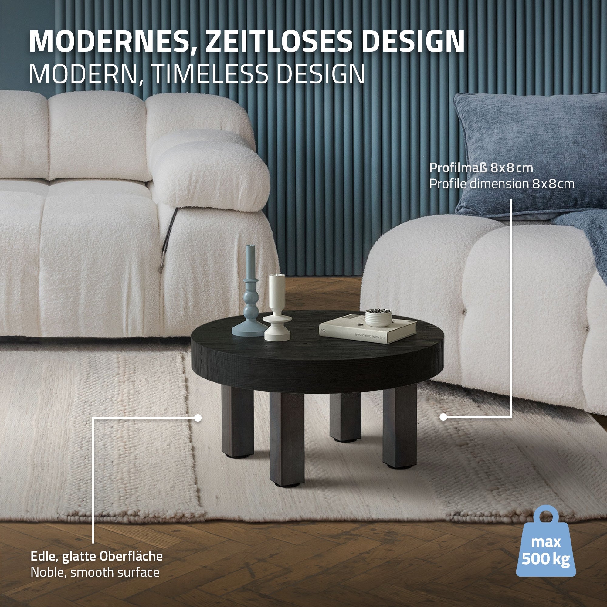 Round coffee table with black surface and sturdy legs.