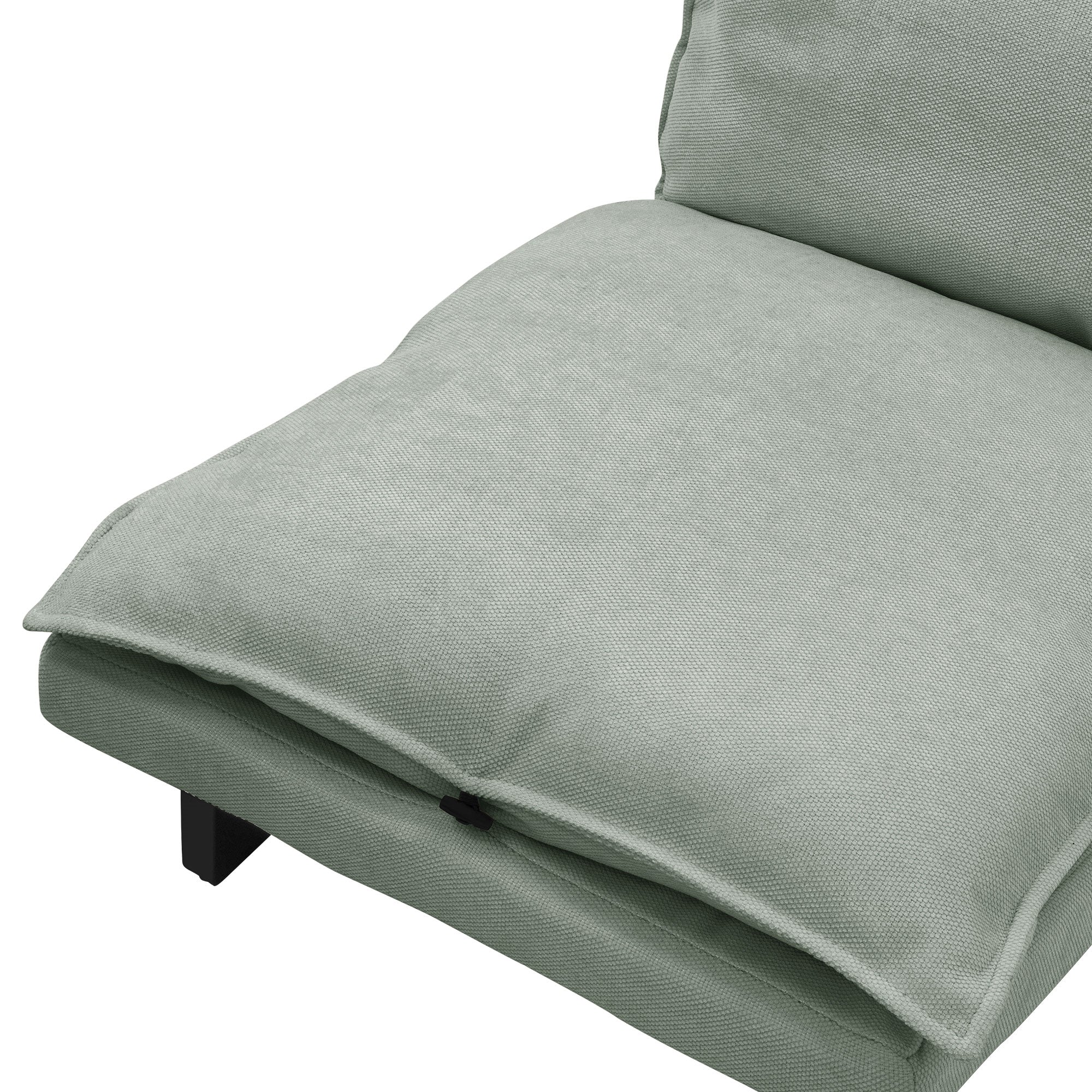 Gros plan d'un fauteuil vert avec un siège rembourré.