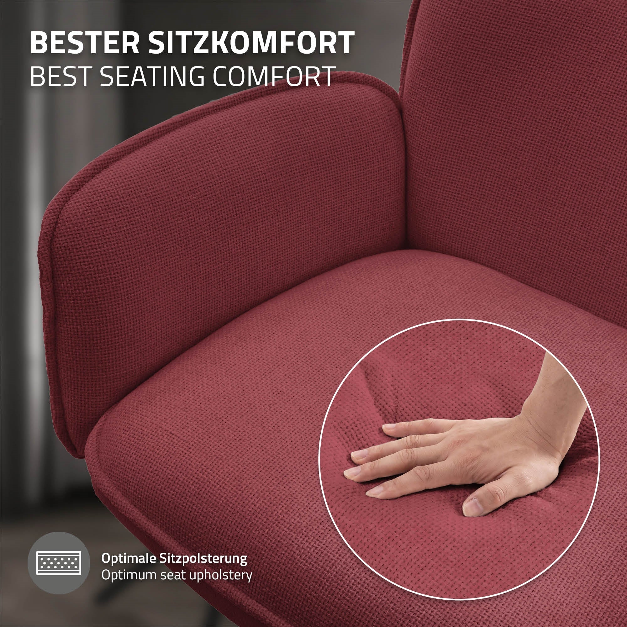 Eine Hand drückt auf die Polsterung eines roten Stuhls.
