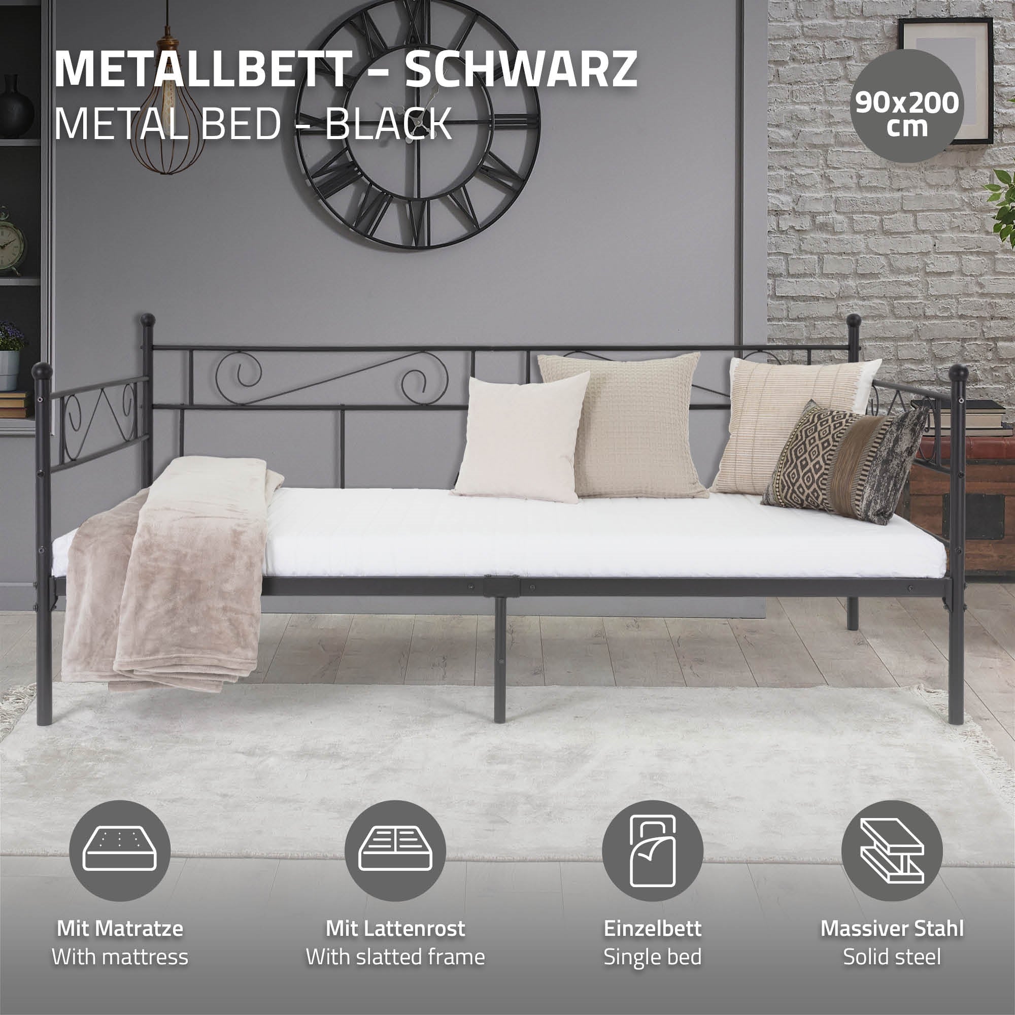 Schwarzmetallbett mit Matratze, Lattengestell und Kissen.