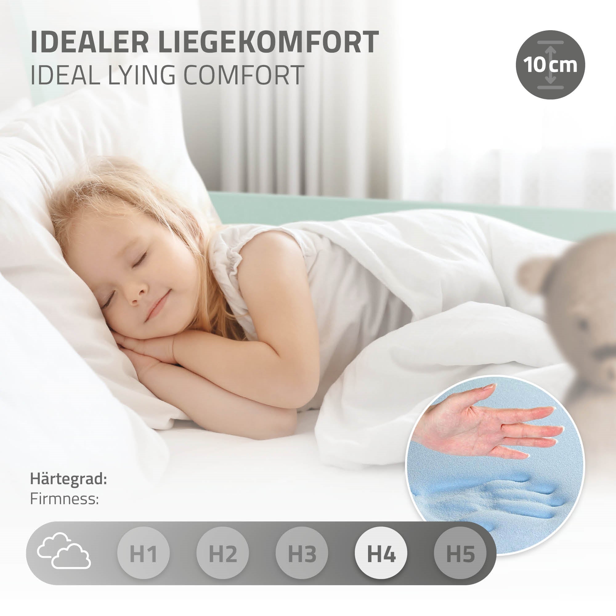 A sleeping child on a mattress with a pillow.