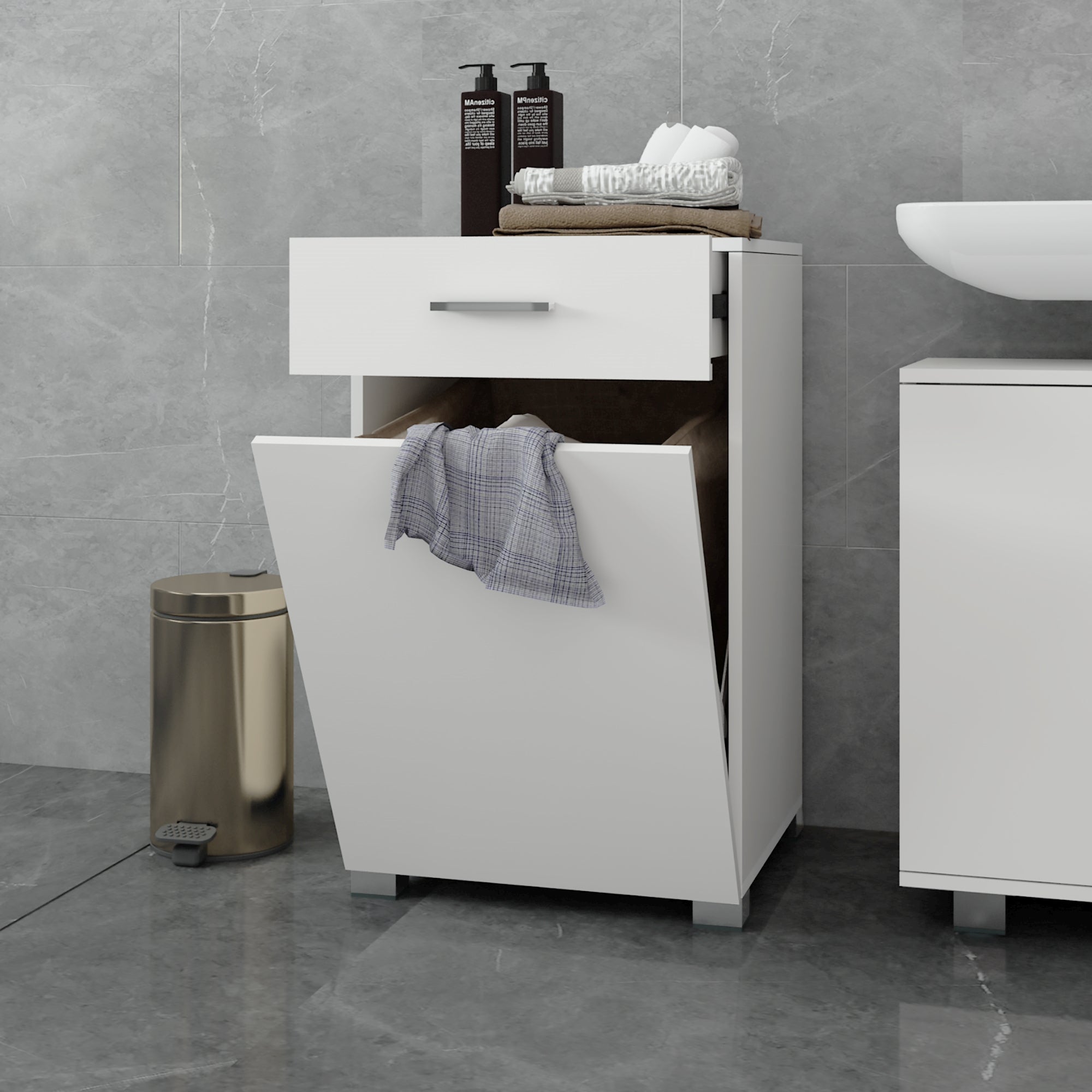 White laundry basket with a towel and care products on a gray tile.