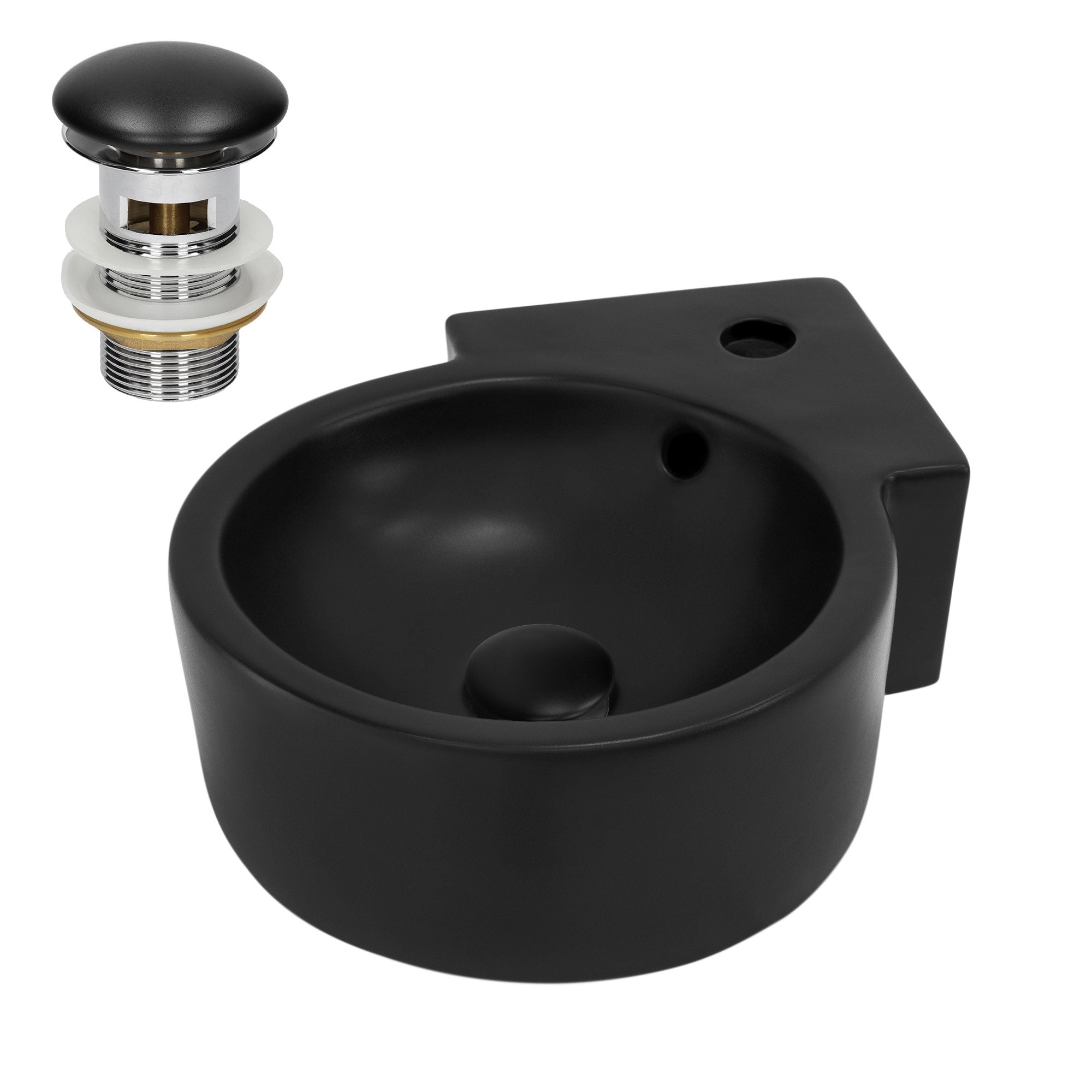 Lavabo negro redondo con tapón de desagüe.