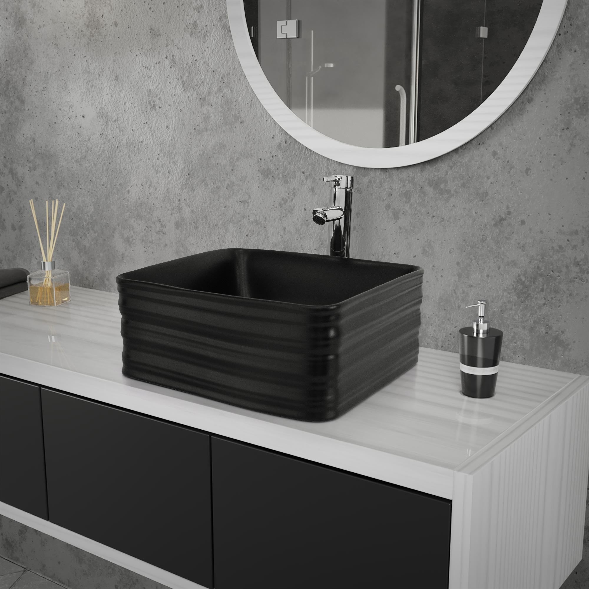 Black sink on a modern bathroom washstand with mirror.