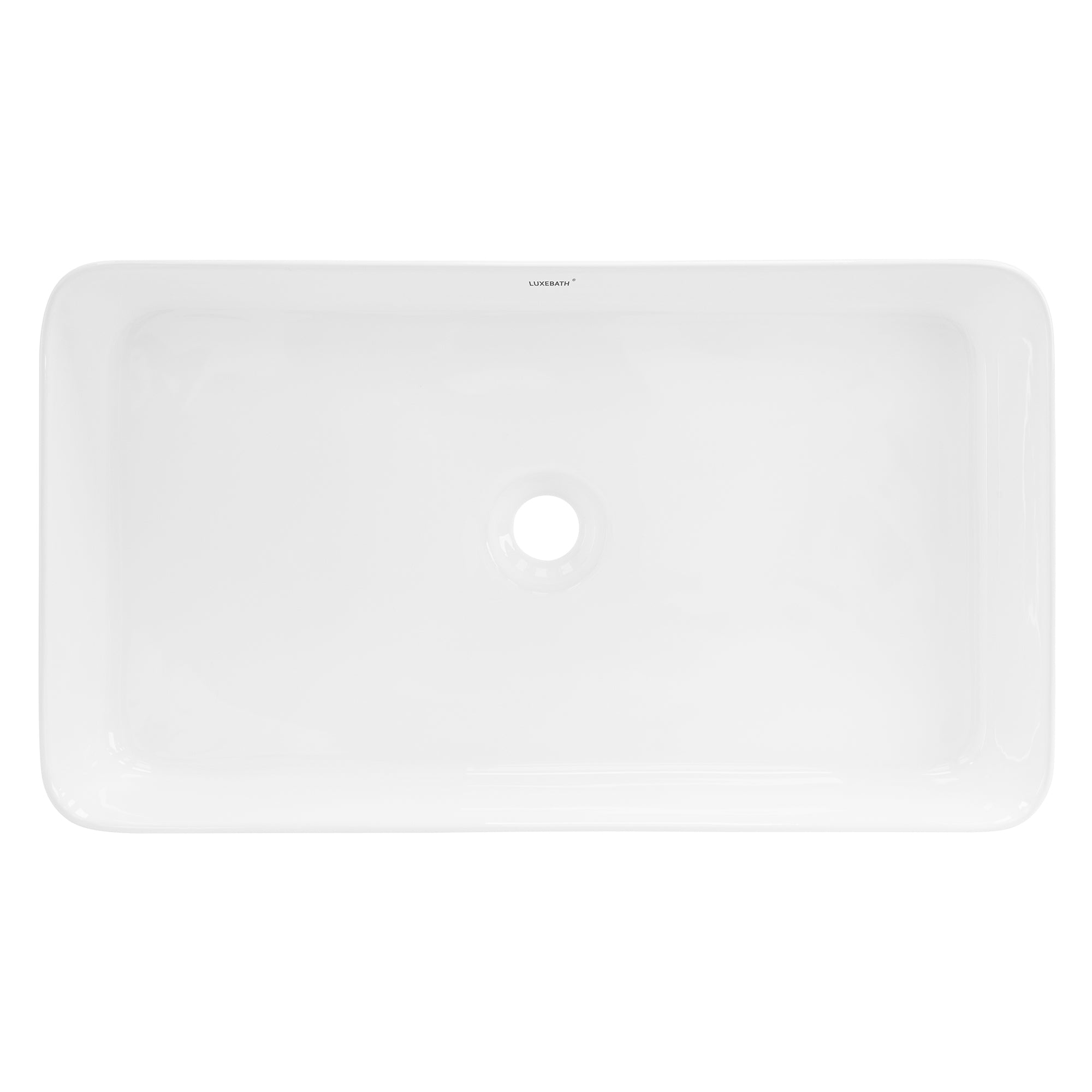 Lavabo blanc rectangulaire avec trou d'évacuation central.