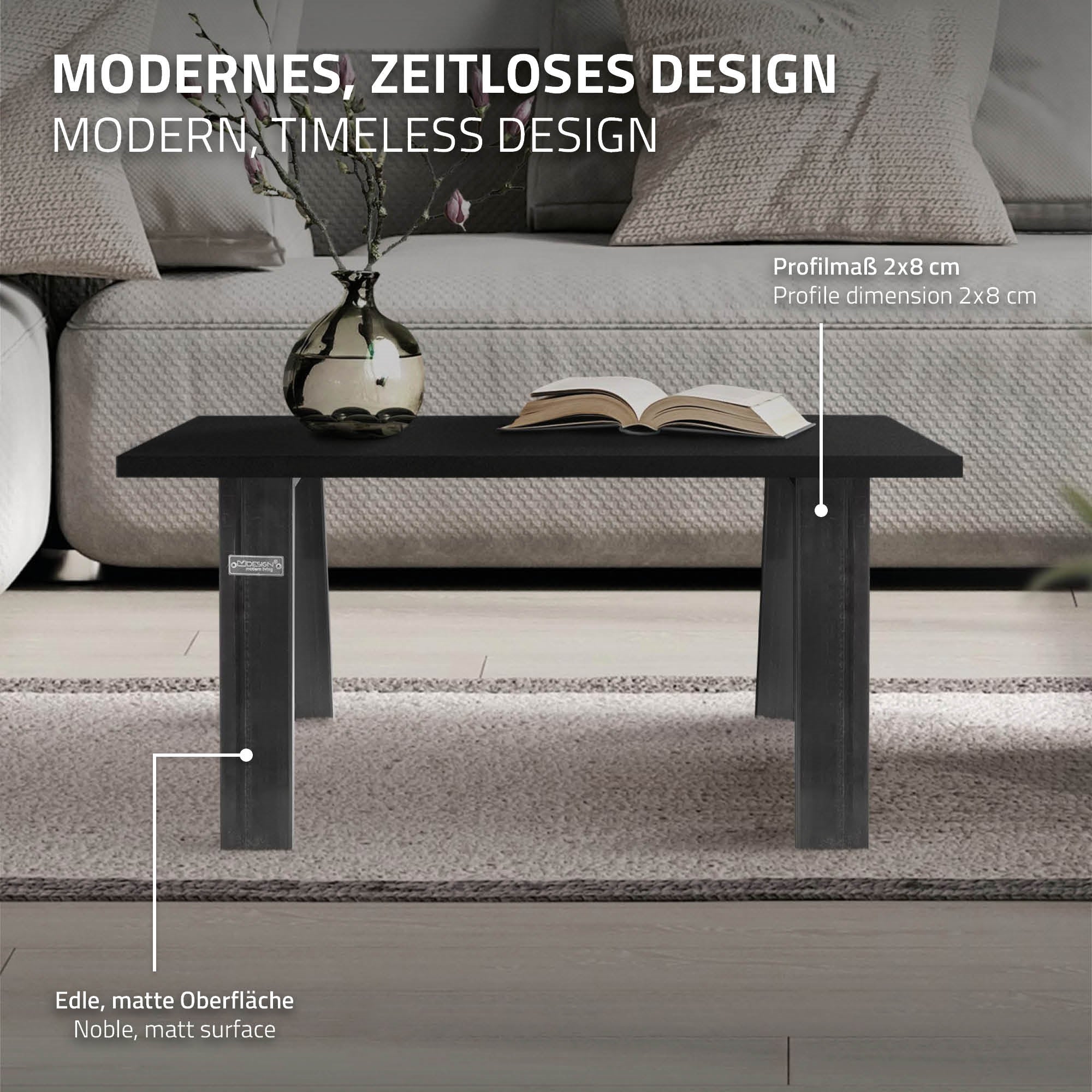 Black table with a vase on a matte tabletop, dimensions and design description.