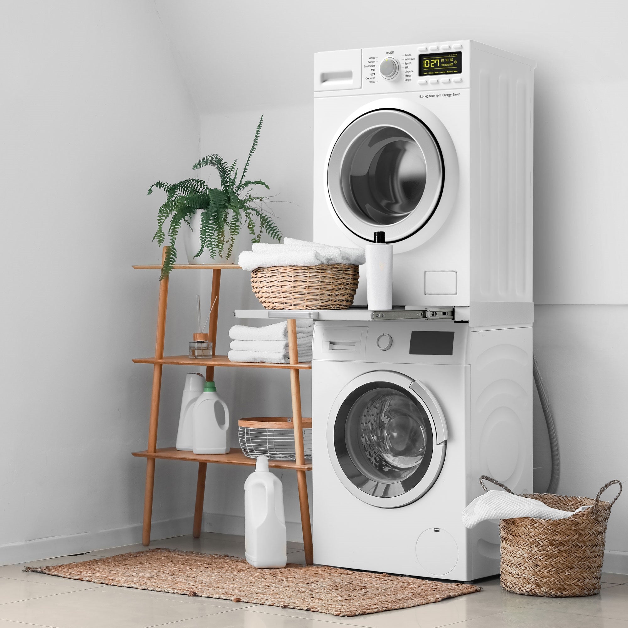 Washing machine and dryer on a shelf, laundry basket next to it.