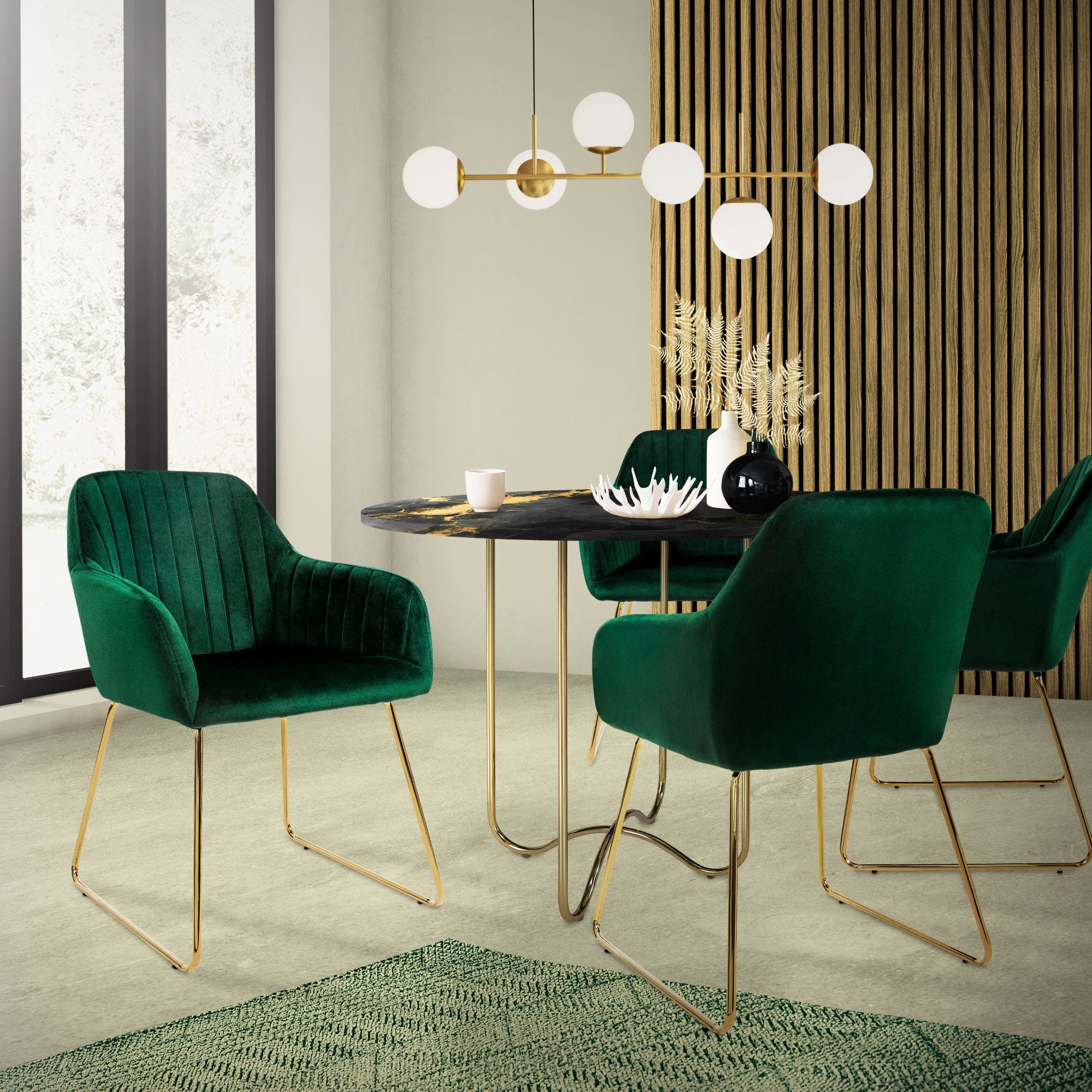 Un comedor con una mesa redonda y cuatro sillones verdes.