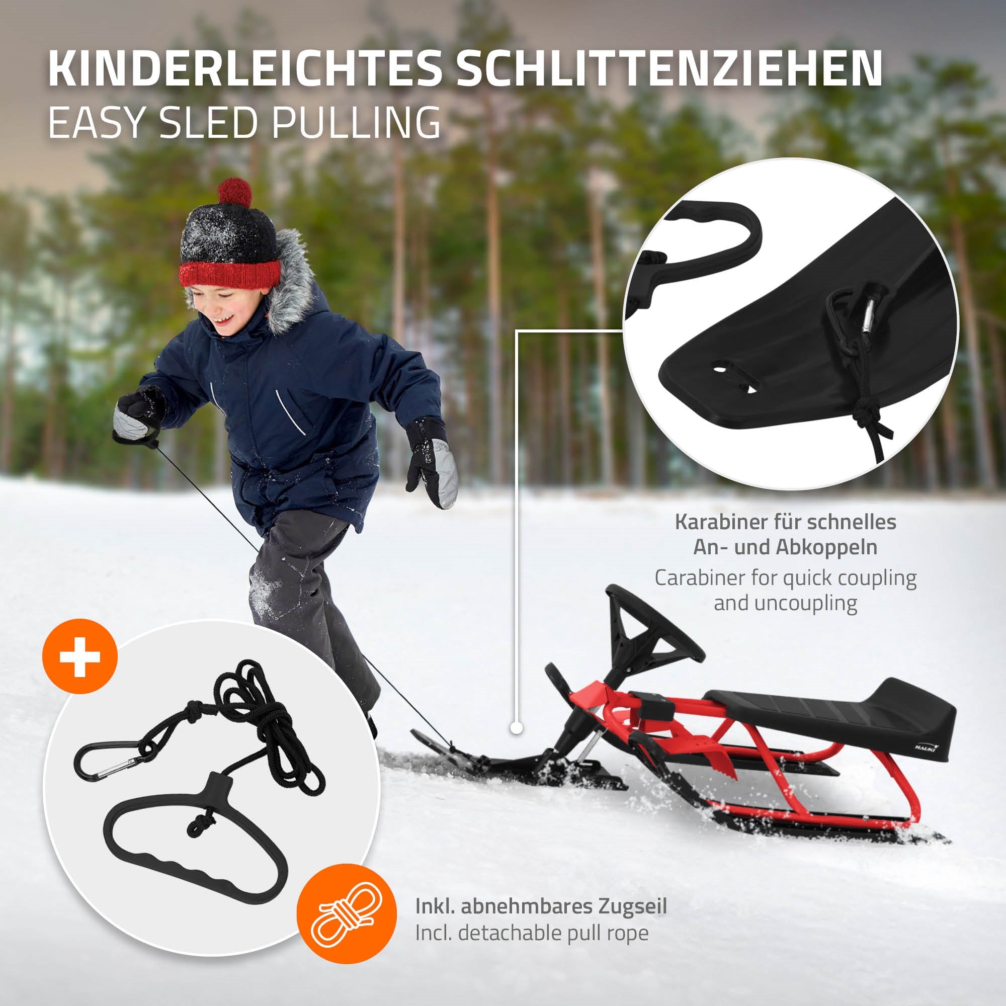 Garçon tirant une luge dans la neige, avec un mousqueton et une corde de traction amovible.