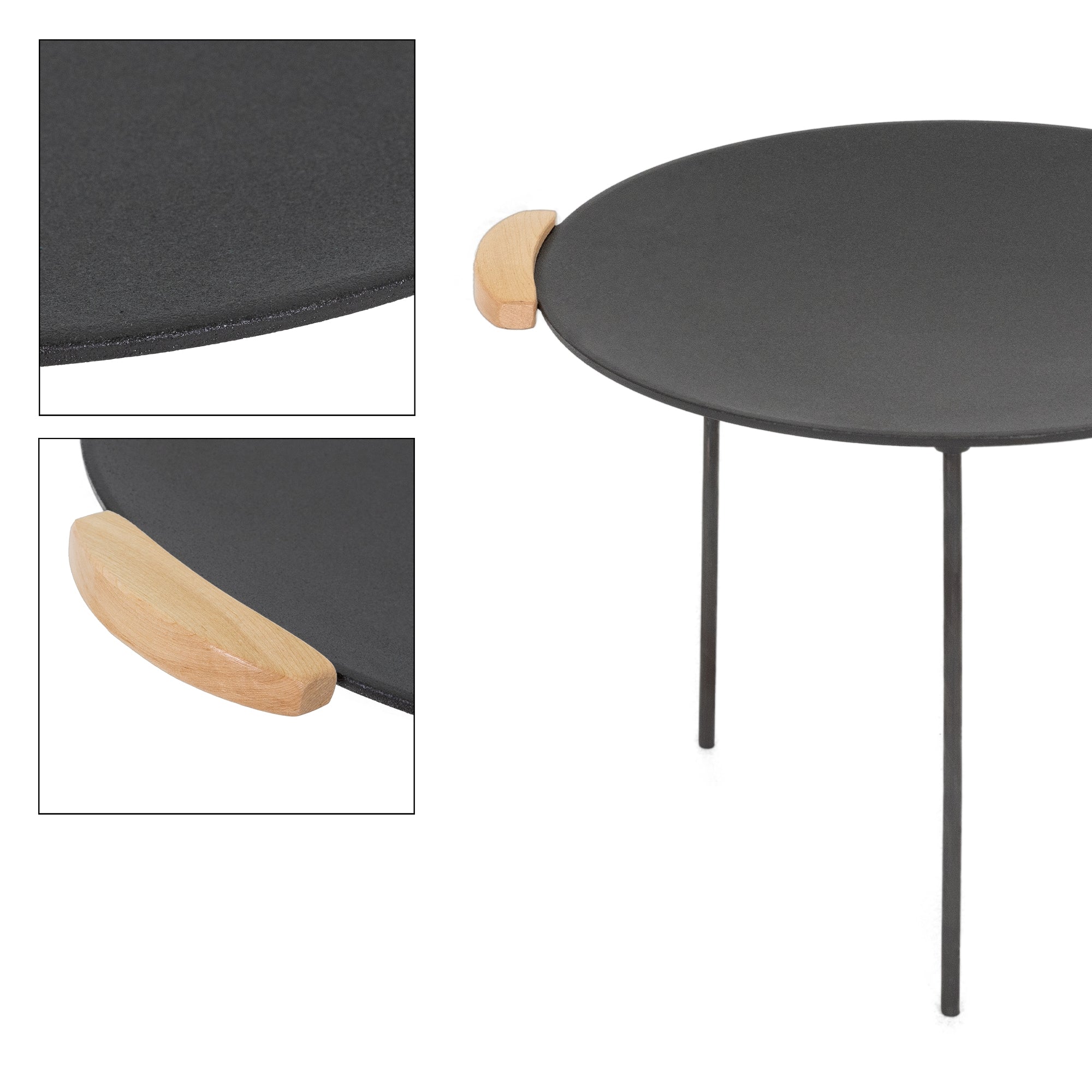 Table ronde avec surface noire et poignée en bois.