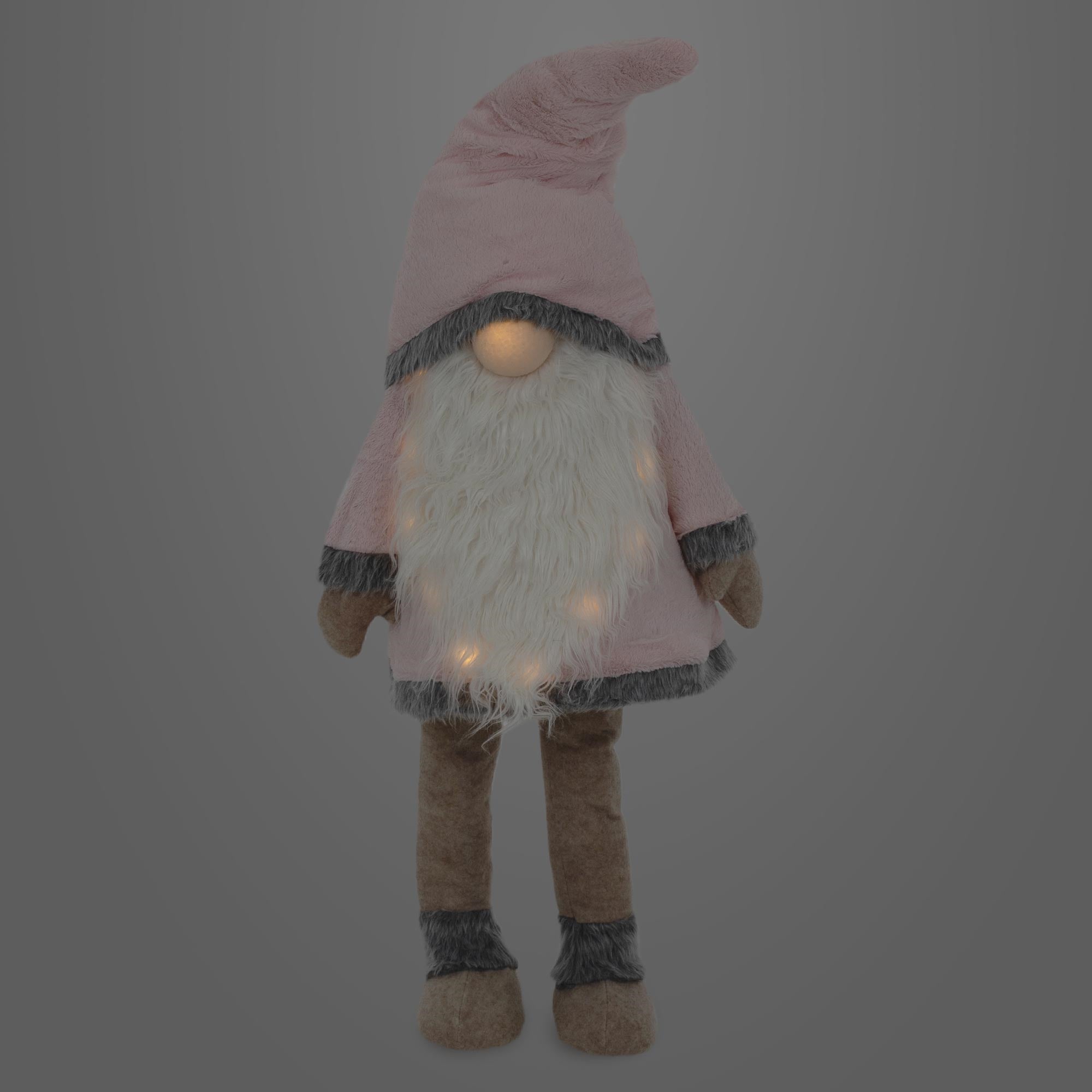 Plüschfigur eines Gnomes mit rosa Hut und leuchtenden Punkten.
