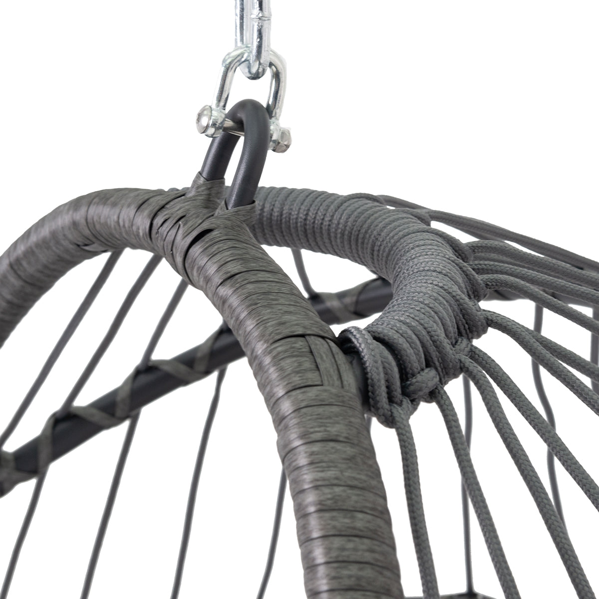 Close-up of the suspension of a hanging chair with rope and carabiner.