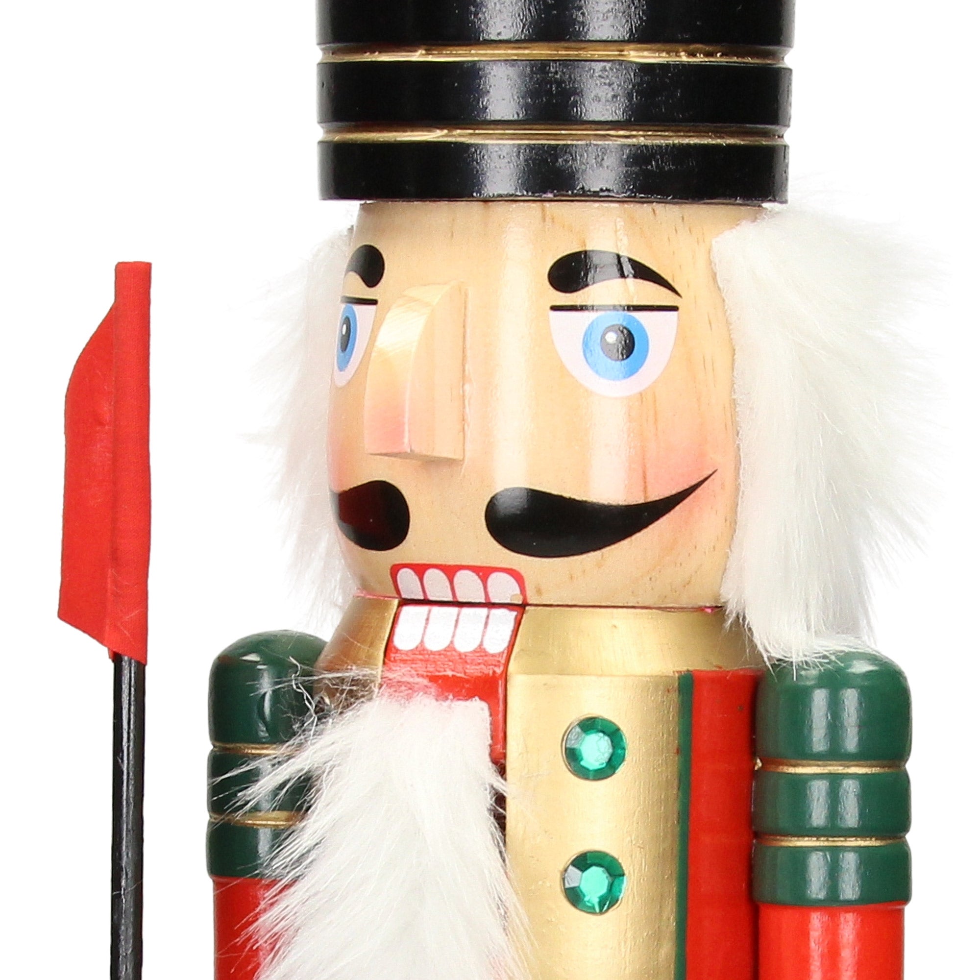 Close-up of a nutcracker with a red hat and green uniform.