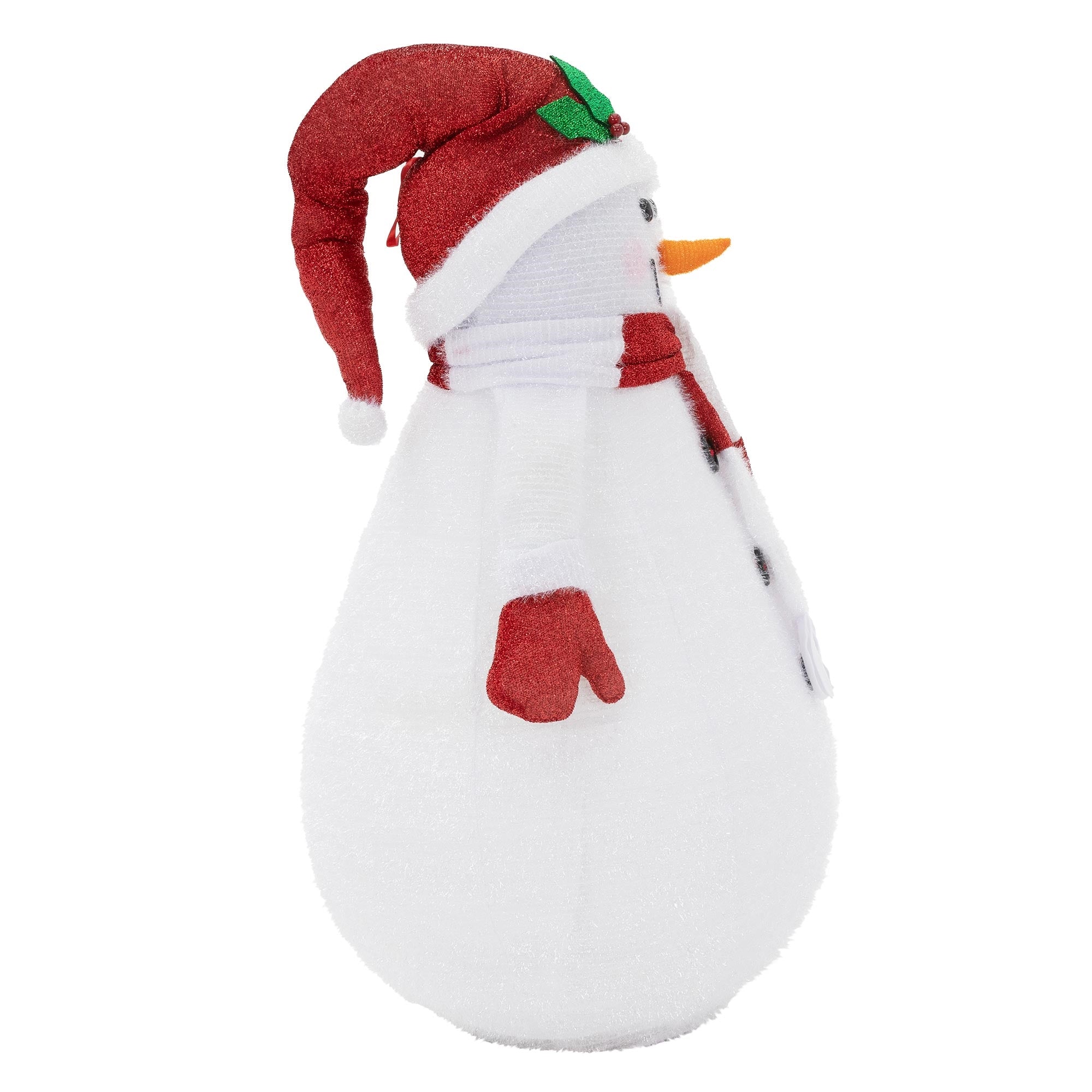 Vue de côté d'un bonhomme de neige avec un chapeau rouge et une écharpe.