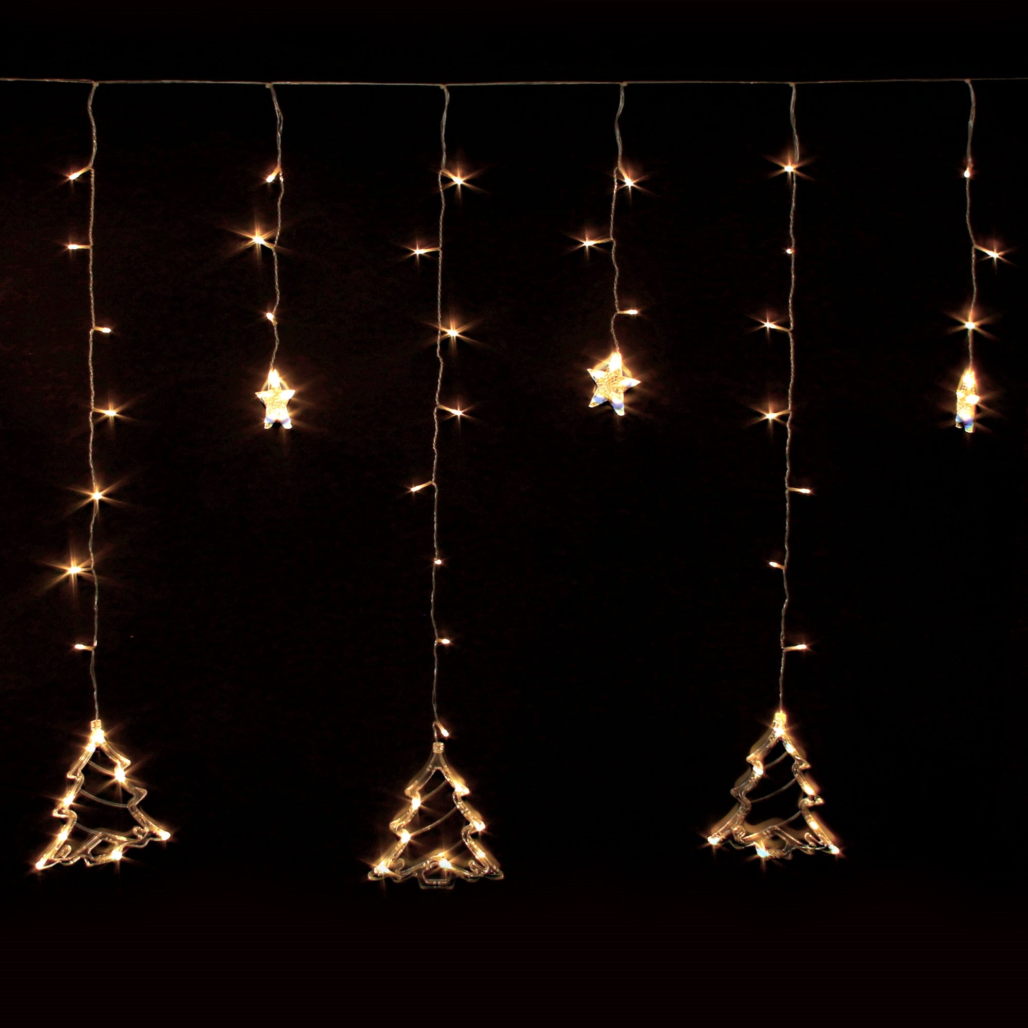 String lights with hanging Christmas tree and star motifs on a black background.