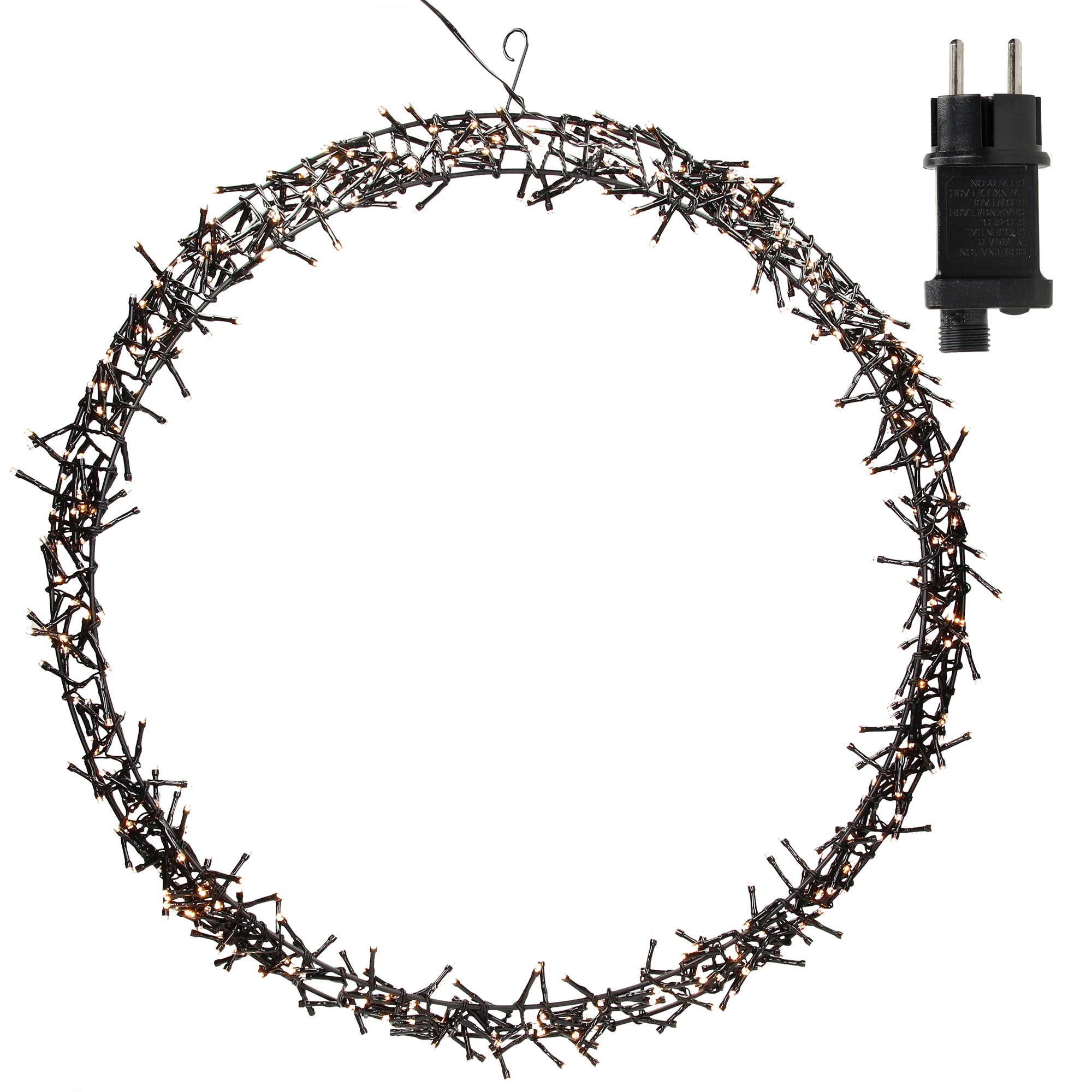 A lit wreath with a plug next to it.