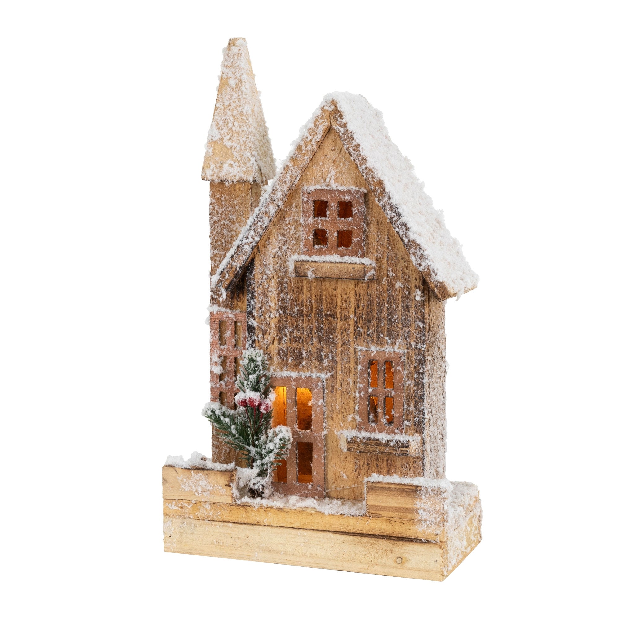 Holzhaus mit Schnee und Lichtern, umgeben von kleinen Pflanzen.