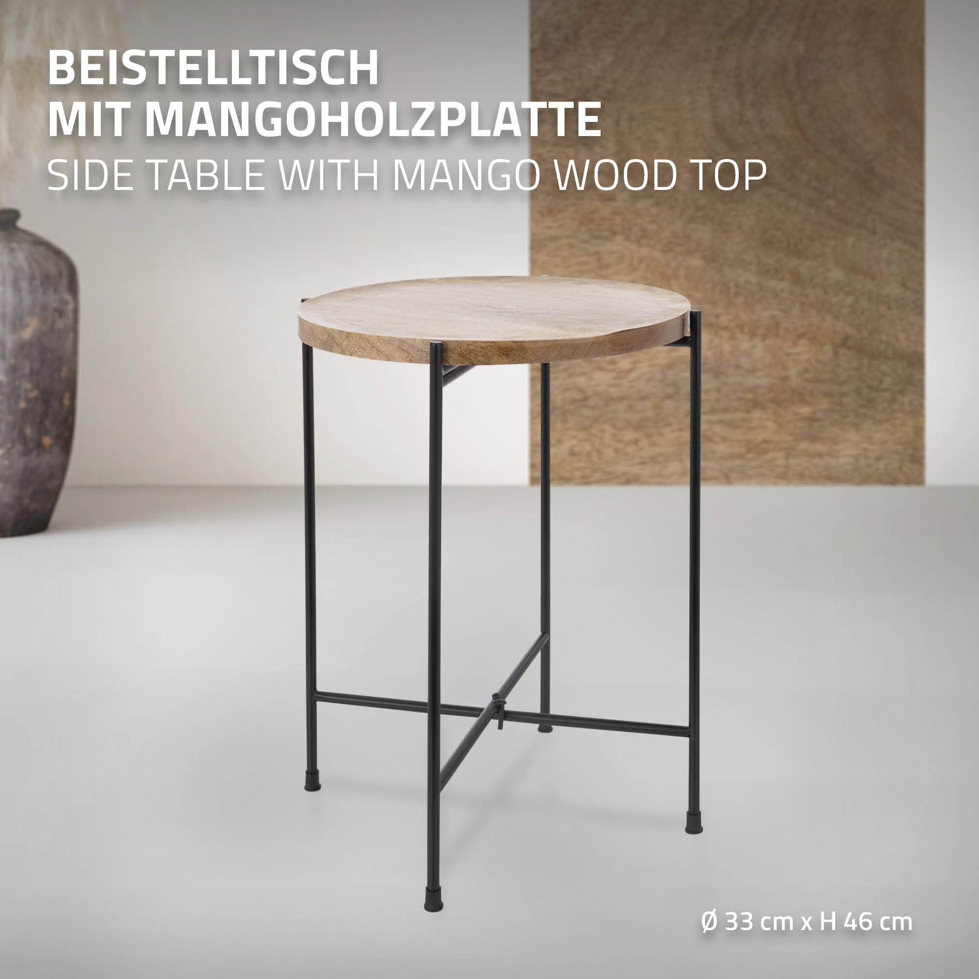Tavolino con piano in legno di mango rotondo e struttura in metallo nero.