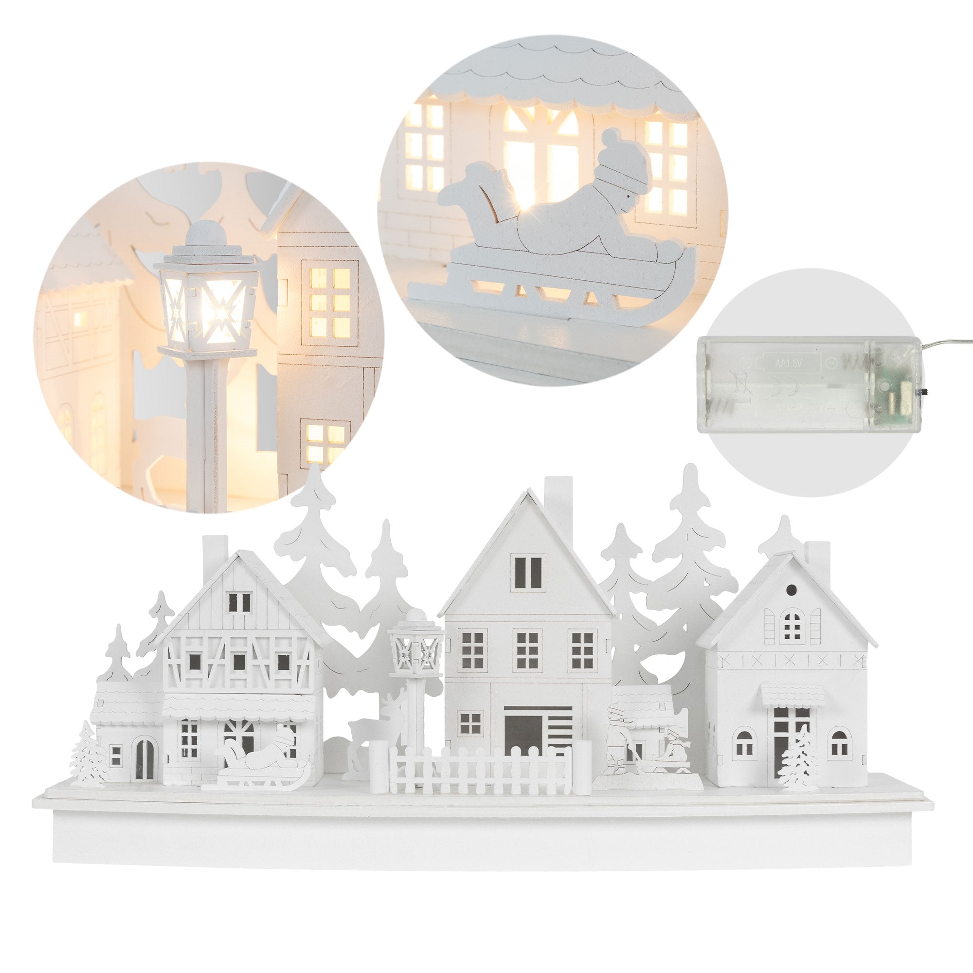 Vue détaillée d'un paysage de maisons décoratives avec une lanterne et des figurines.