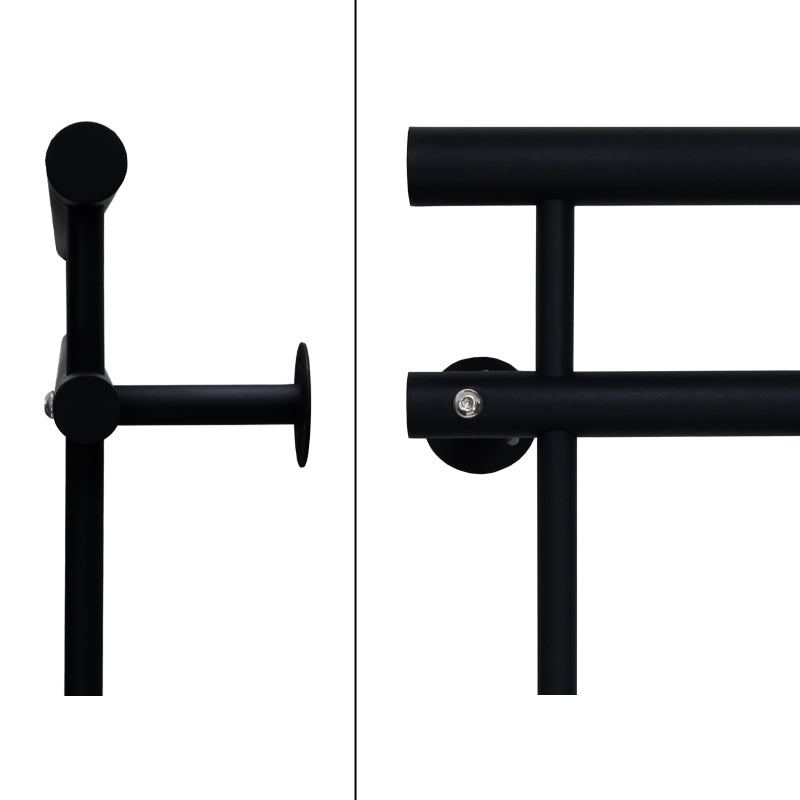 Close-up of a black metal frame with round and rectangular elements.