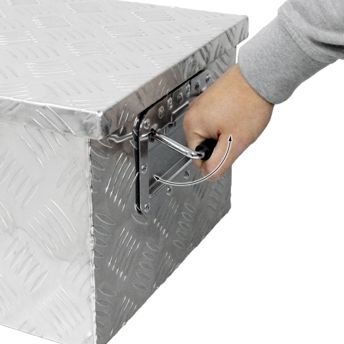 Hand reaching for the closure of a silver storage box.