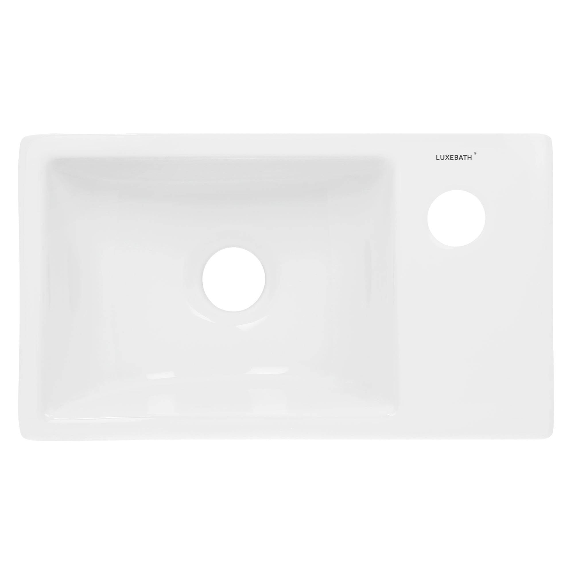 Lavabo rectangular de material blanco con un agujero en el lado derecho.
