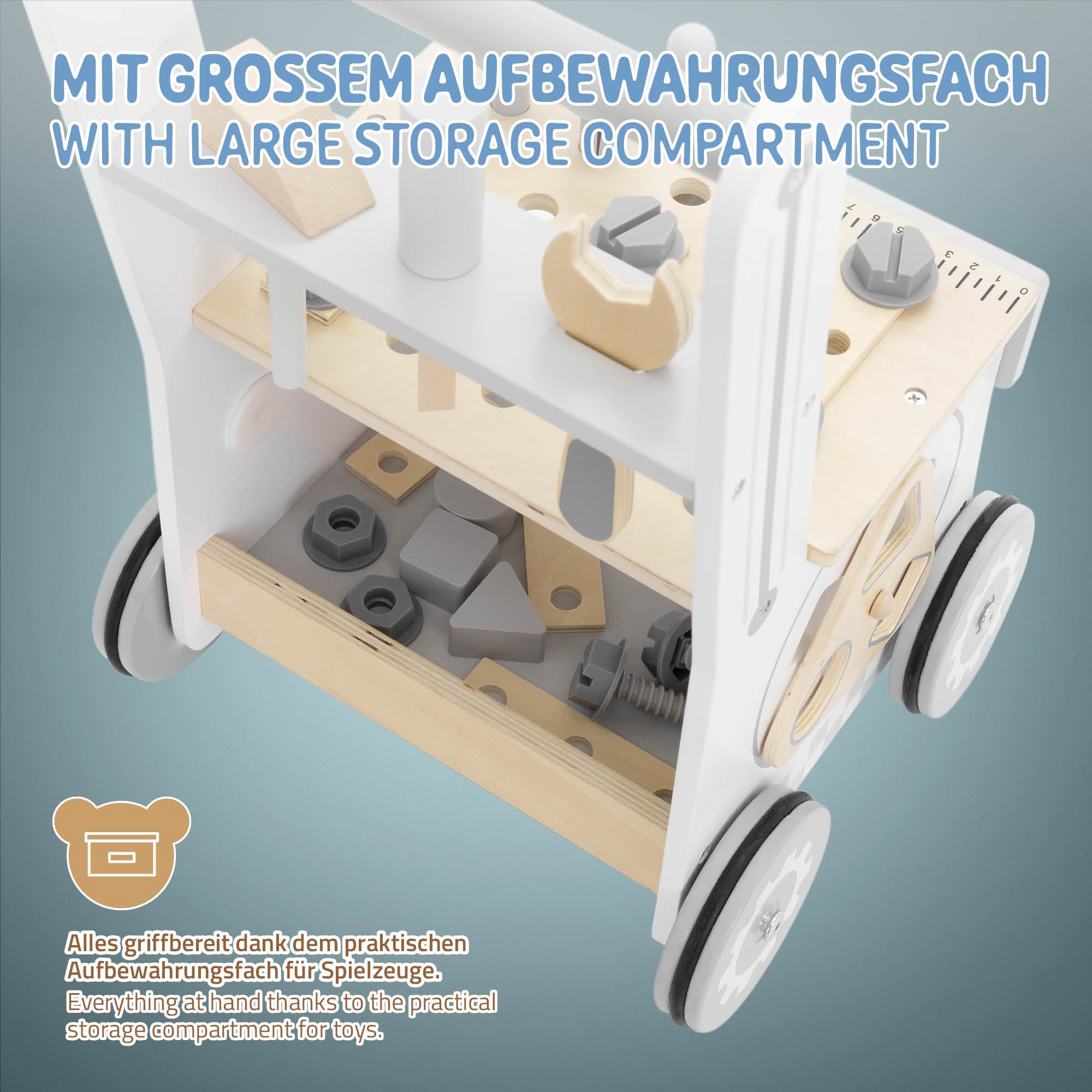 Un chariot de jouets avec un grand compartiment de rangement et divers éléments de jeu.