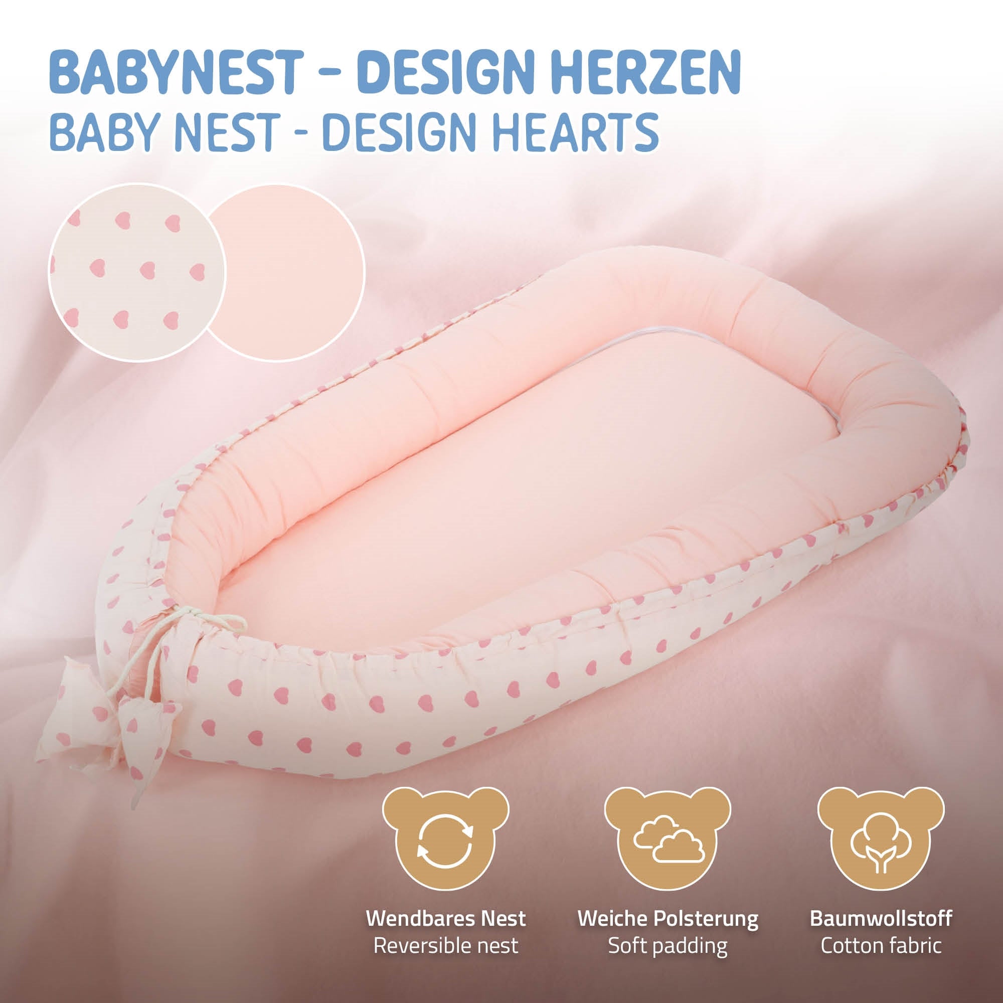 Baby Nest in Herzdesign, rosa mit weißen Herzen, weich gepolstert.