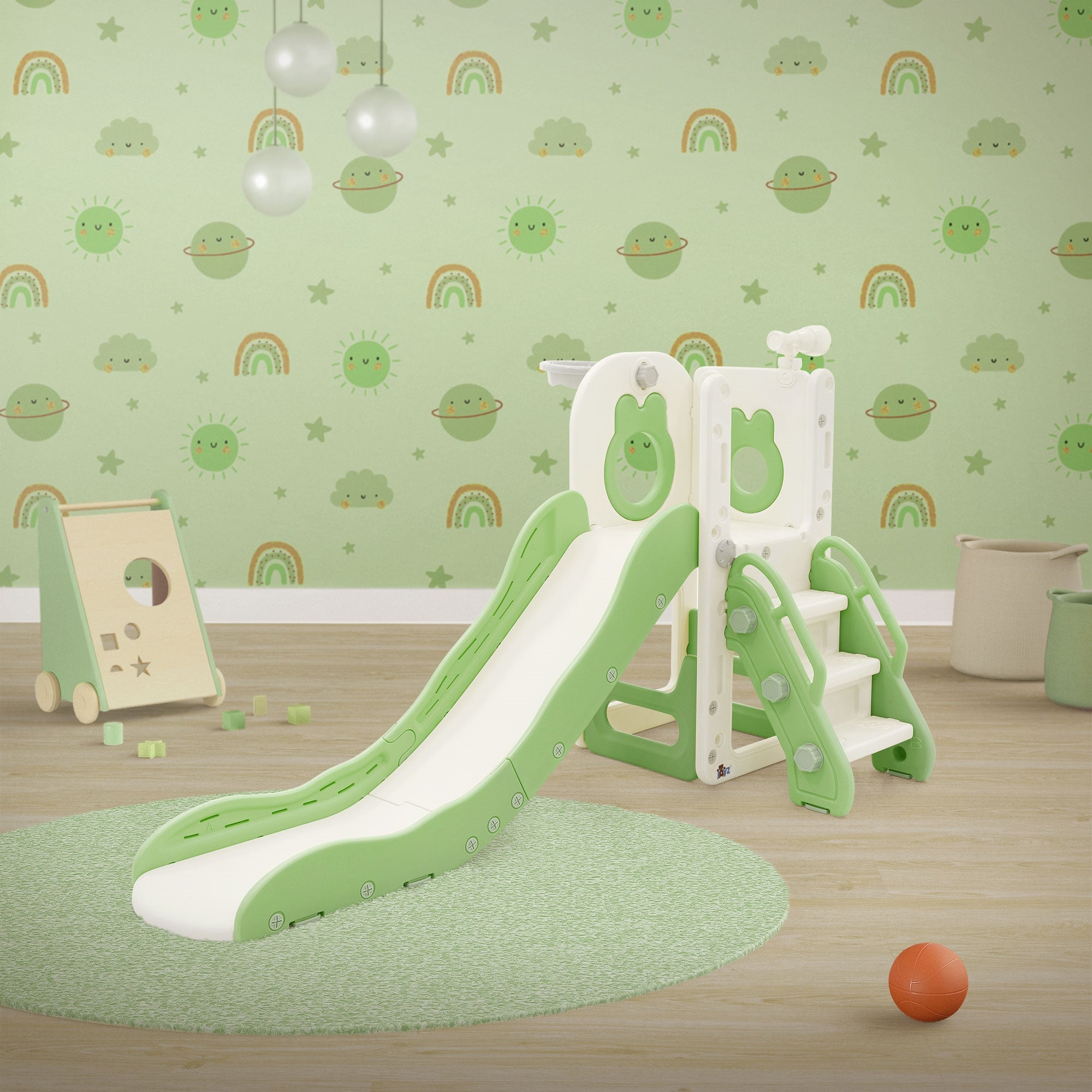 A playground with a slide, stairs, and colorful wall motifs in green and white.