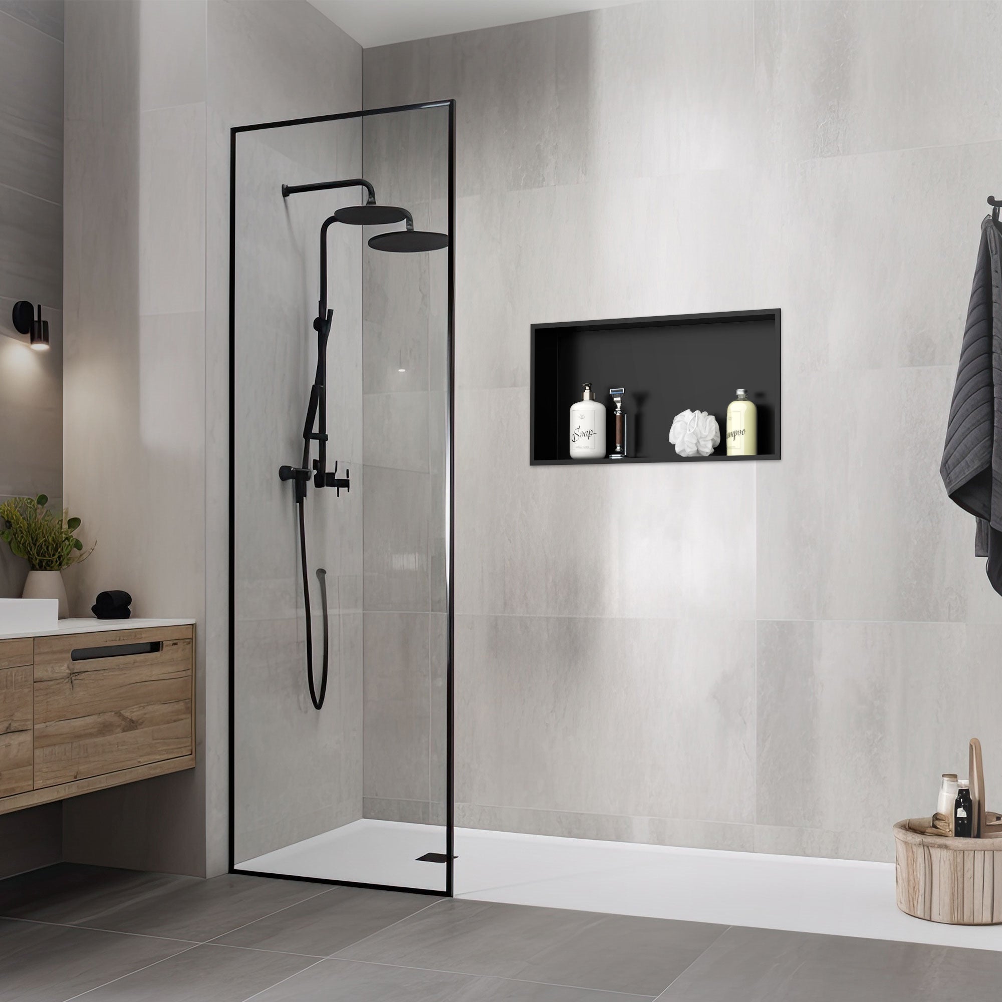 Shower with black shower fitting and wall niche with toiletries.