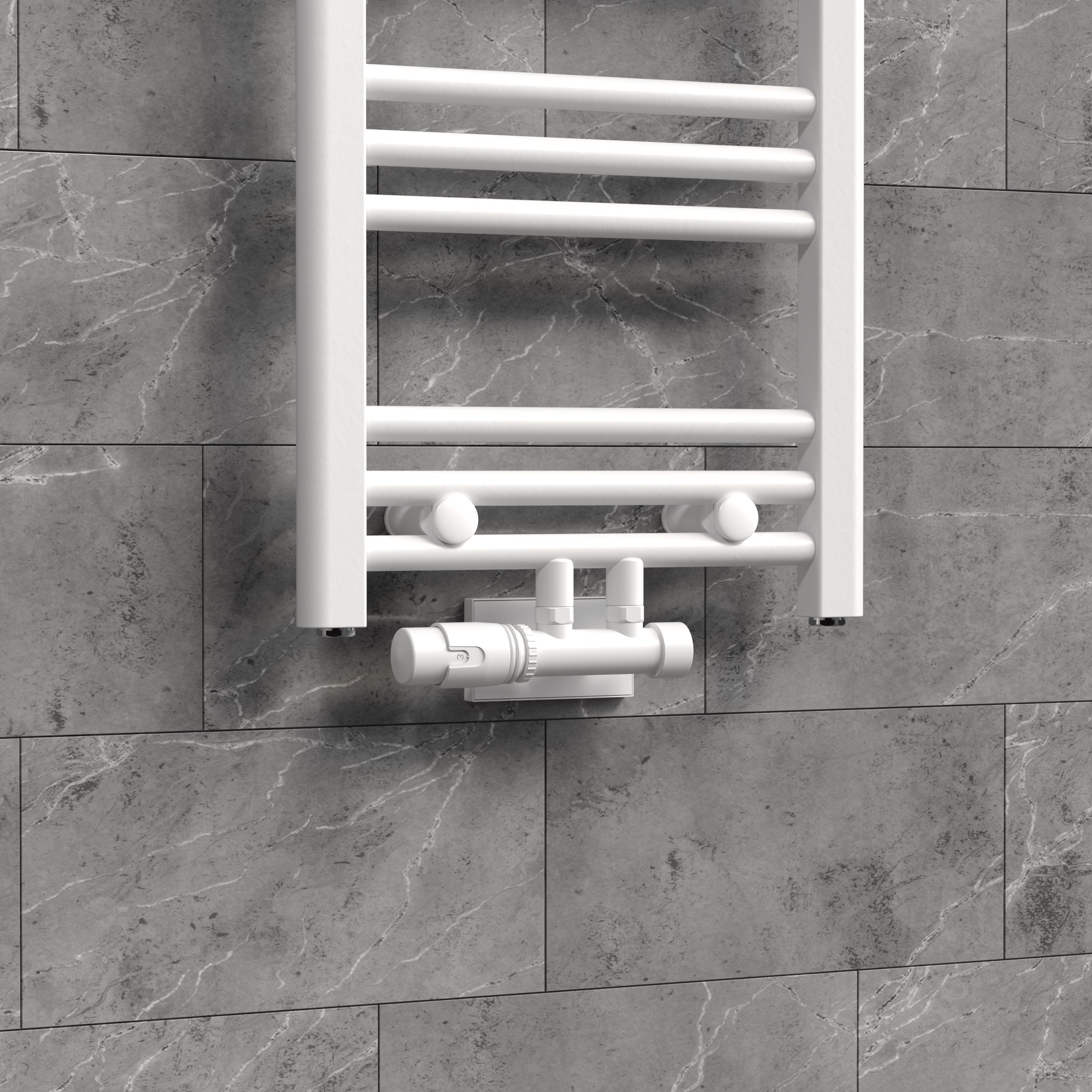 Heizkörper mit weißem Ventil an grauer Wand.