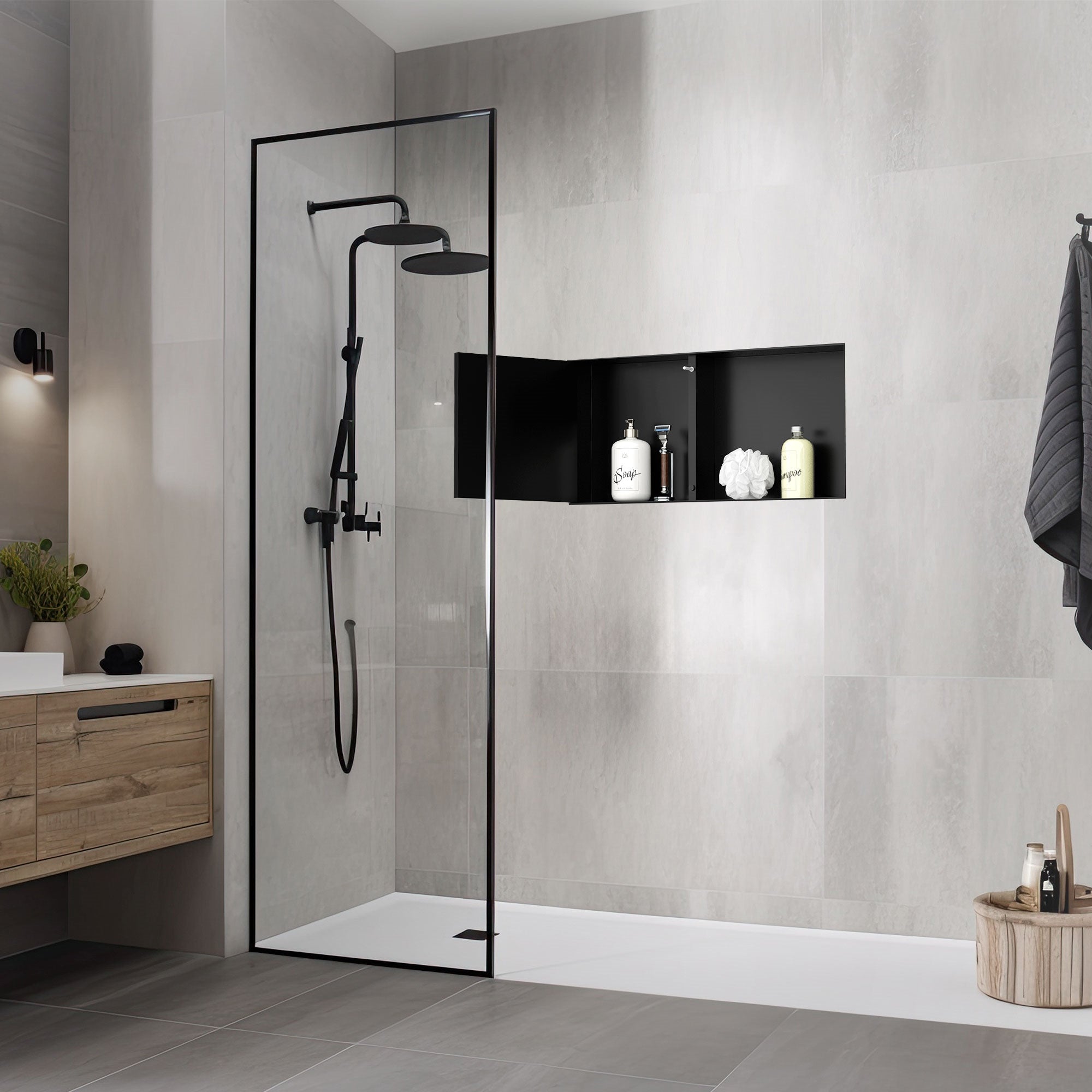 Modern shower with a black showerhead and wall niche filled with personal care products.