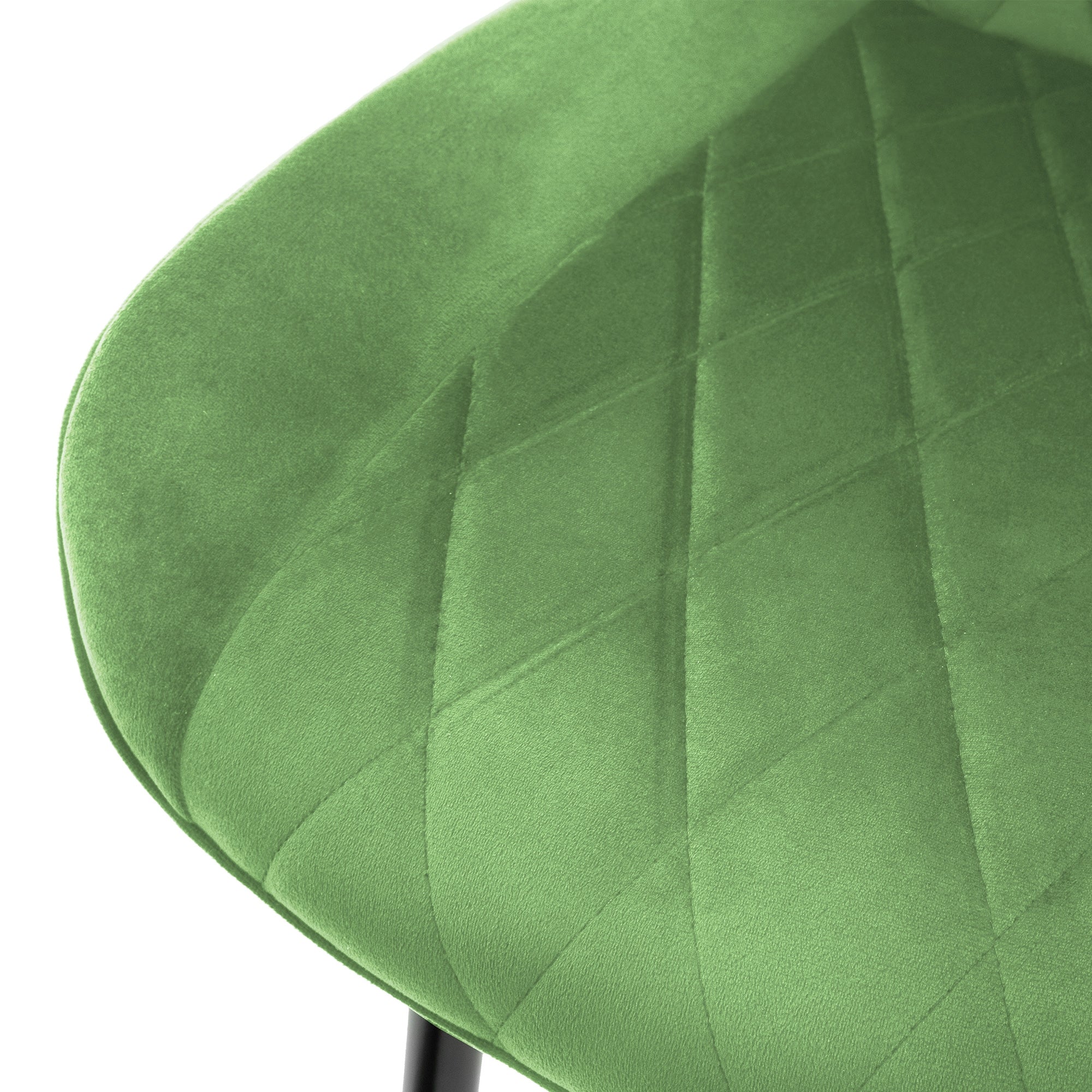 Primo piano di una sedia verde con rivestimento strutturato.