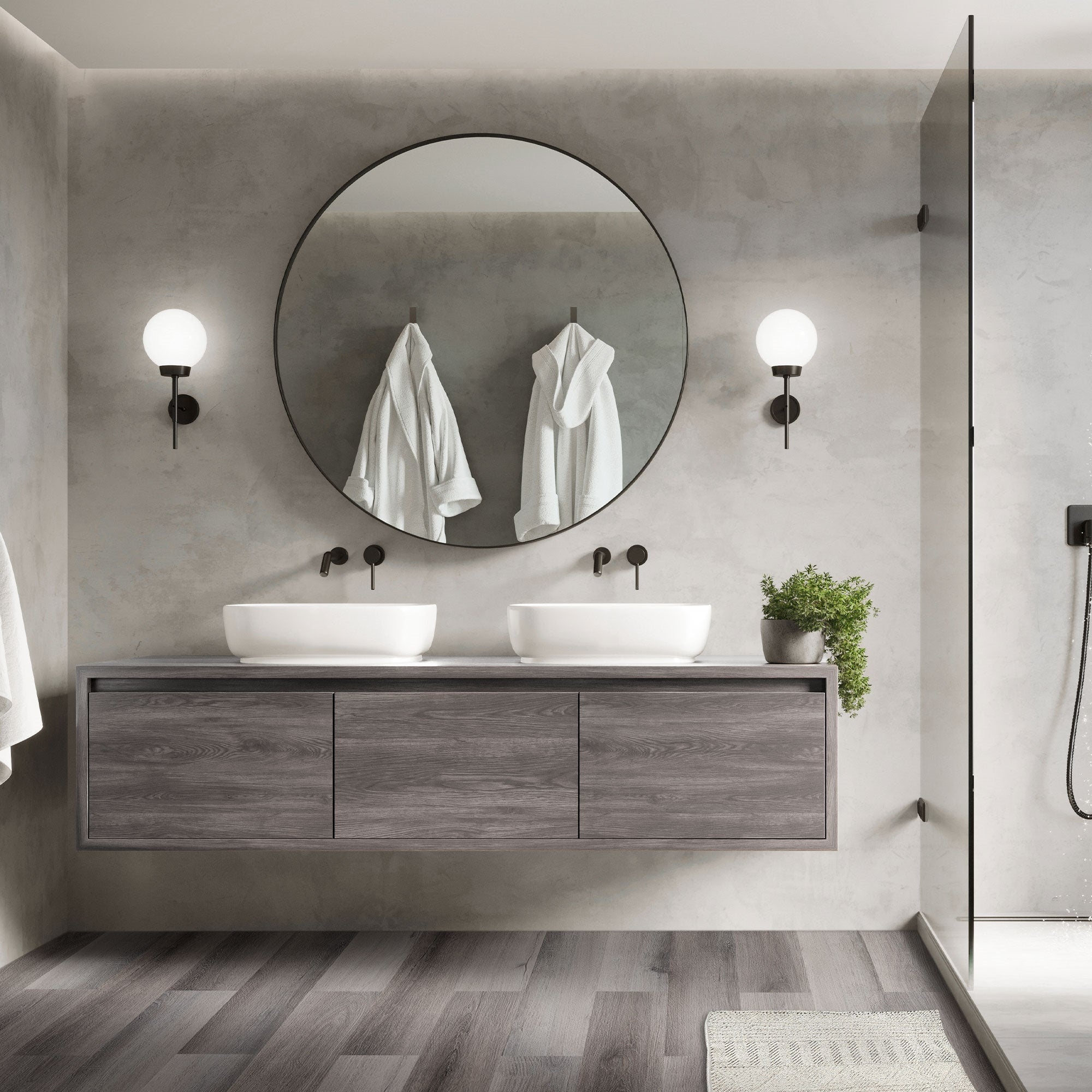Un bagno moderno con due lavandini e asciugamani appesi al muro.