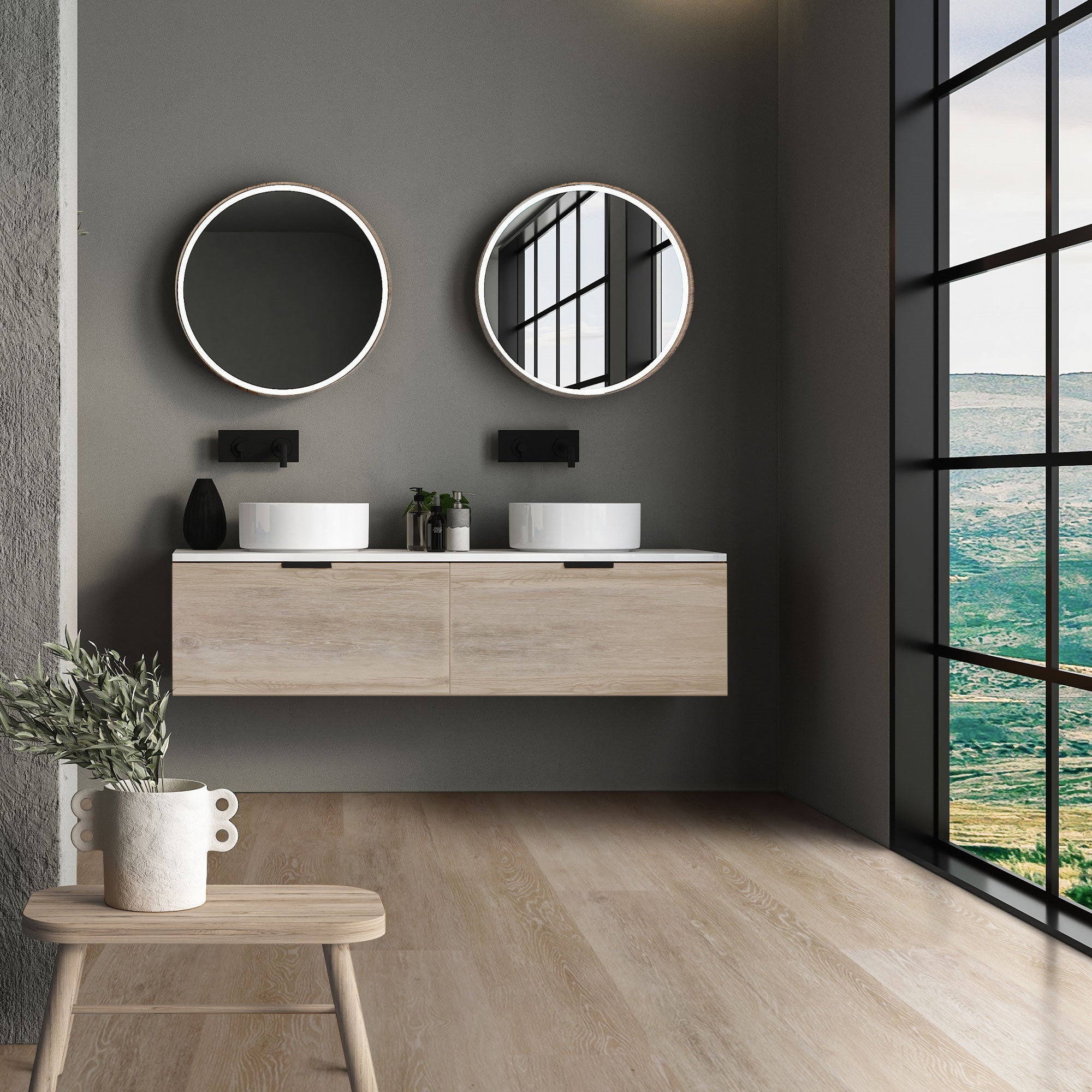 Moderne badkamer met twee ronde spiegels en een houten wastafel.
