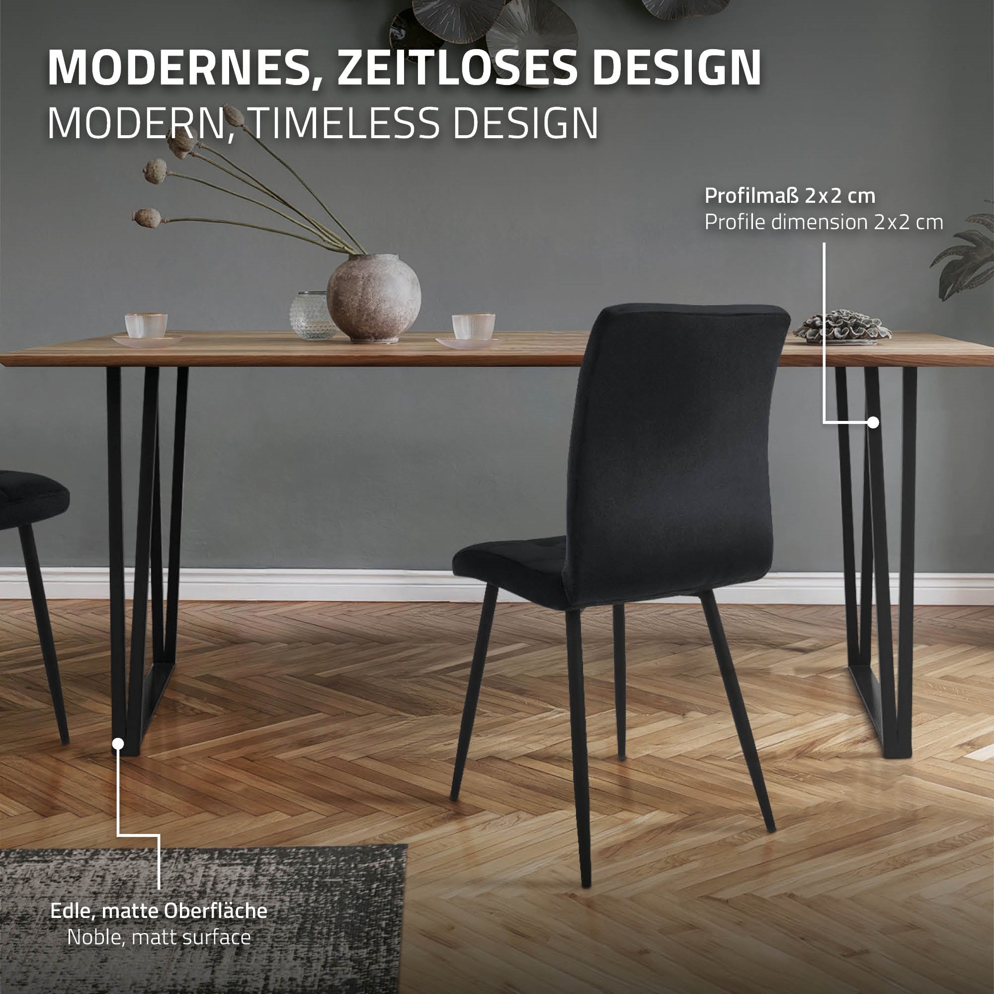 A table with a wooden surface and black metal legs, next to a black chair.