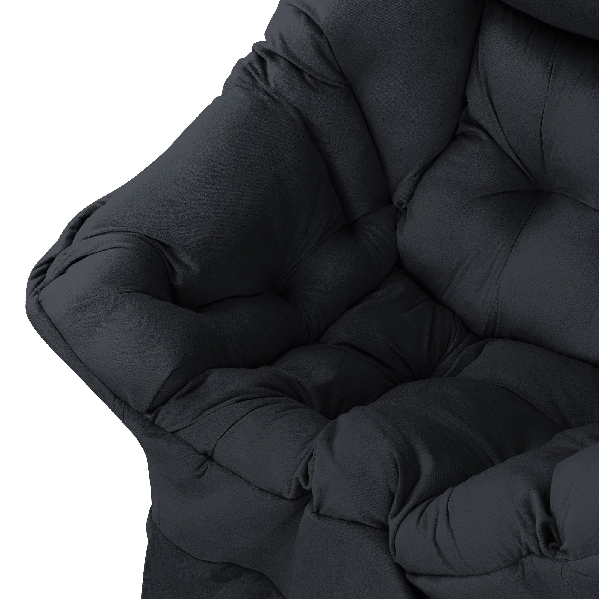 Close-up of a black padded armchair with soft cushions.