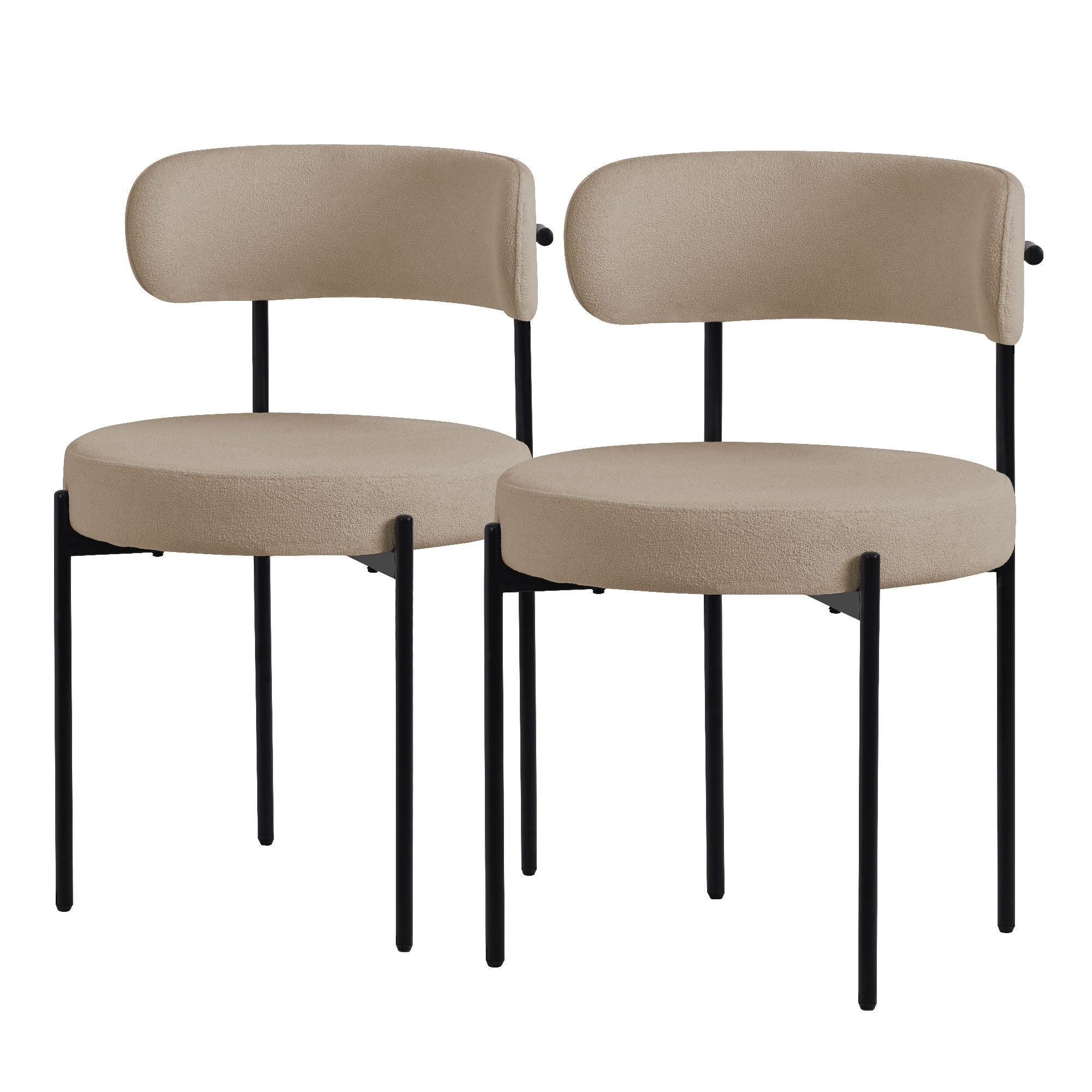 Dos sillas beige con asientos redondos y respaldos sobre patas negras.